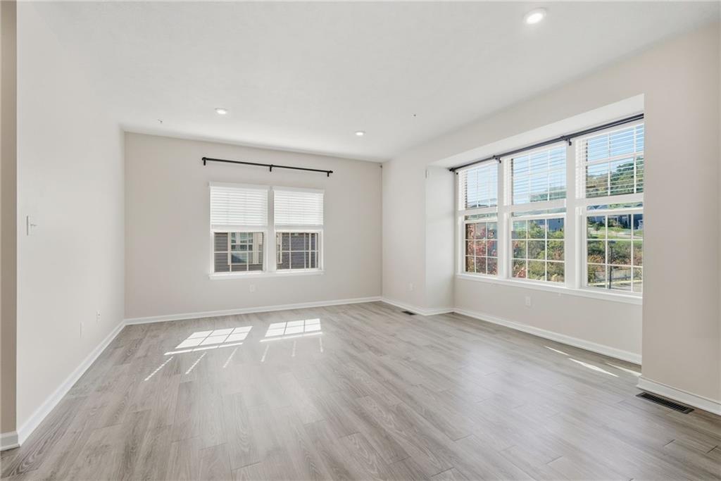 141 Arbor Trail Drive McKees Rocks, PA 15136 - Photo 4 of 44 an empty room with wooden floor and windows