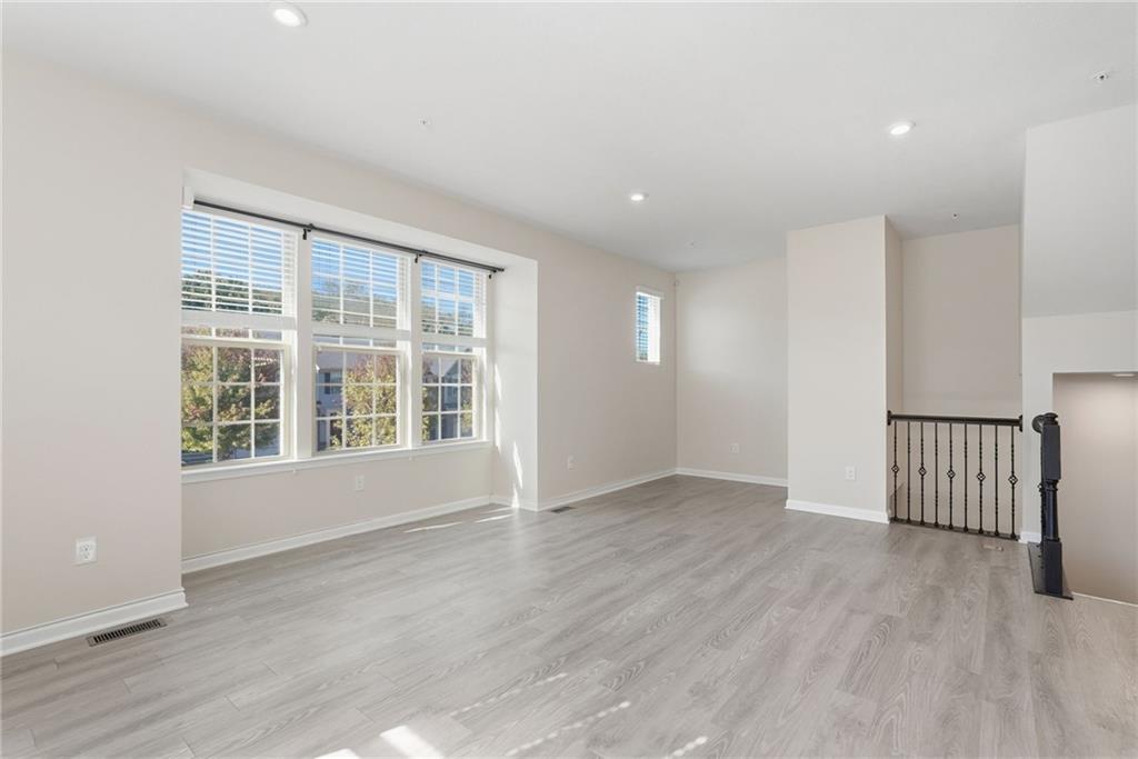 141 Arbor Trail Drive McKees Rocks, PA 15136 - Photo 5 of 44 an empty room with wooden floor and windows