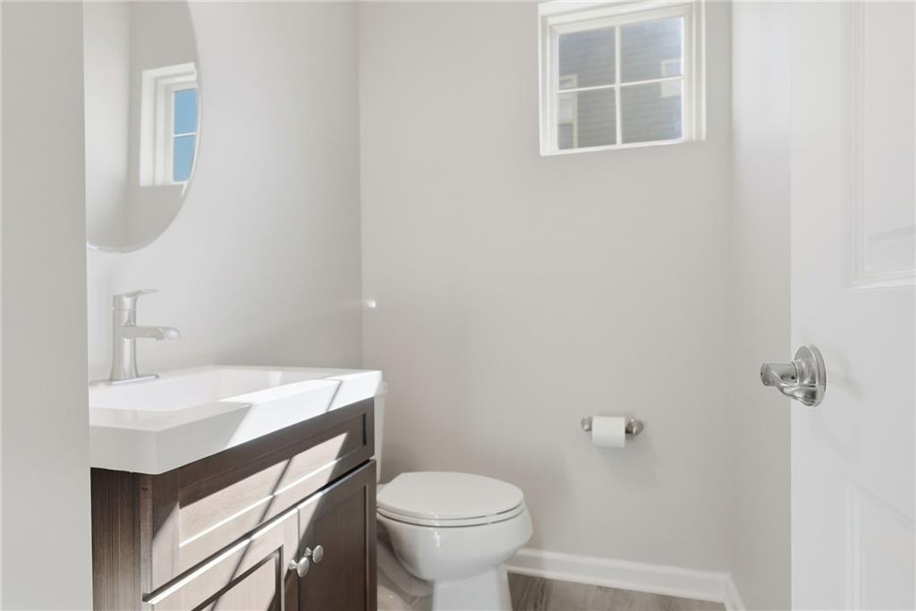 141 Arbor Trail Drive McKees Rocks, PA 15136 - Photo 7 of 44 a bathroom with a sink toilet and a mirror