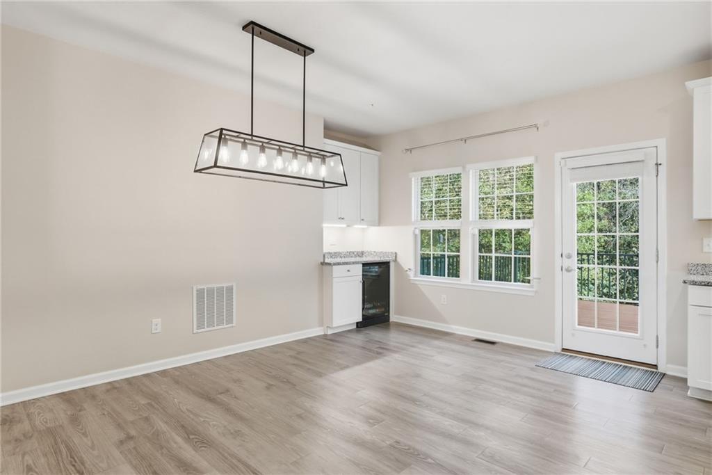 141 Arbor Trail Drive McKees Rocks, PA 15136 - Photo 9 of 44 an empty room with wooden floor and windows