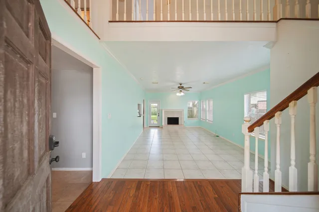 a view of hallway with wooden floor