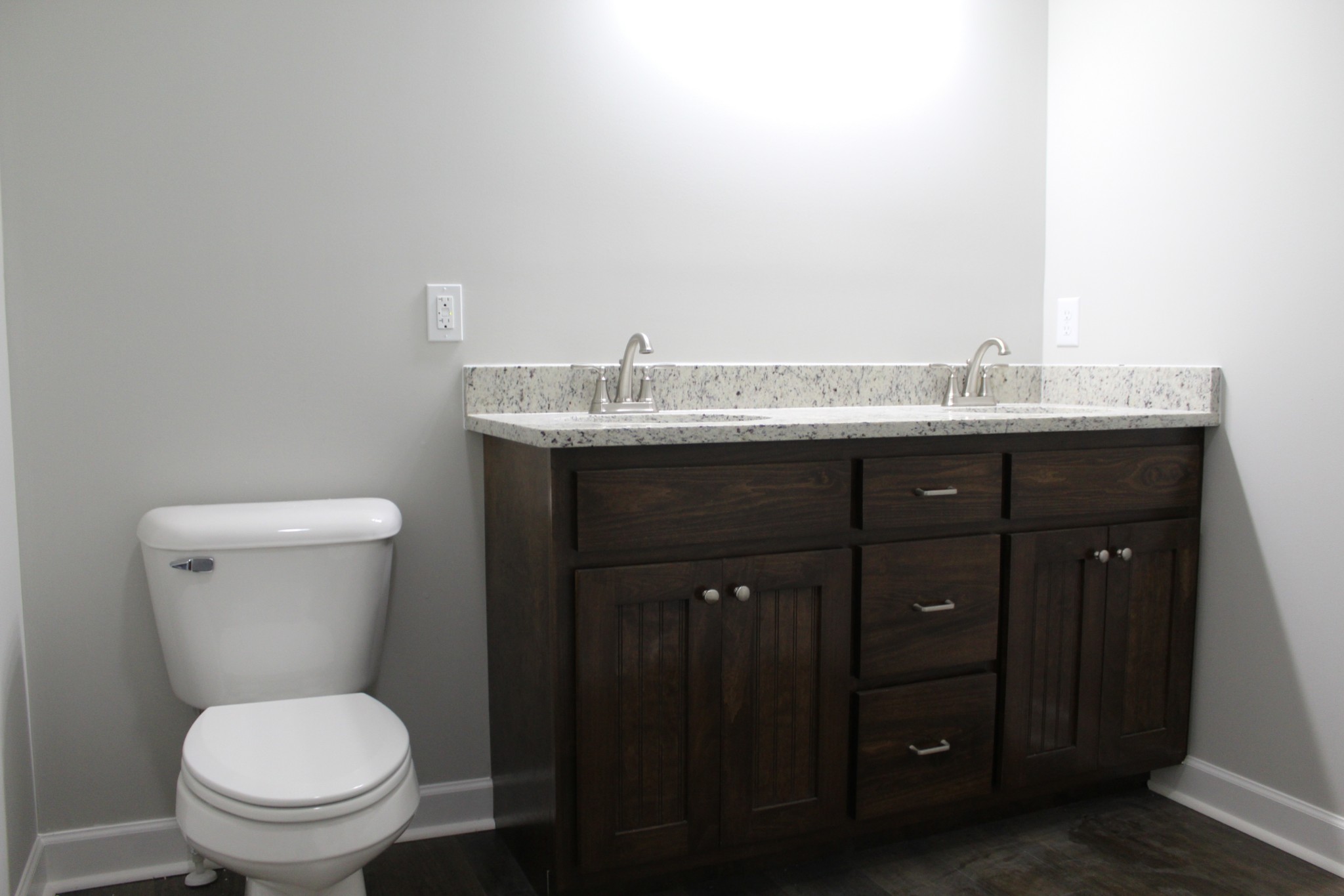 3835 Union Camp Road Lafayette, TN 37083 - Photo 18 of 27 a bathroom with a granite countertop toilet and a sink