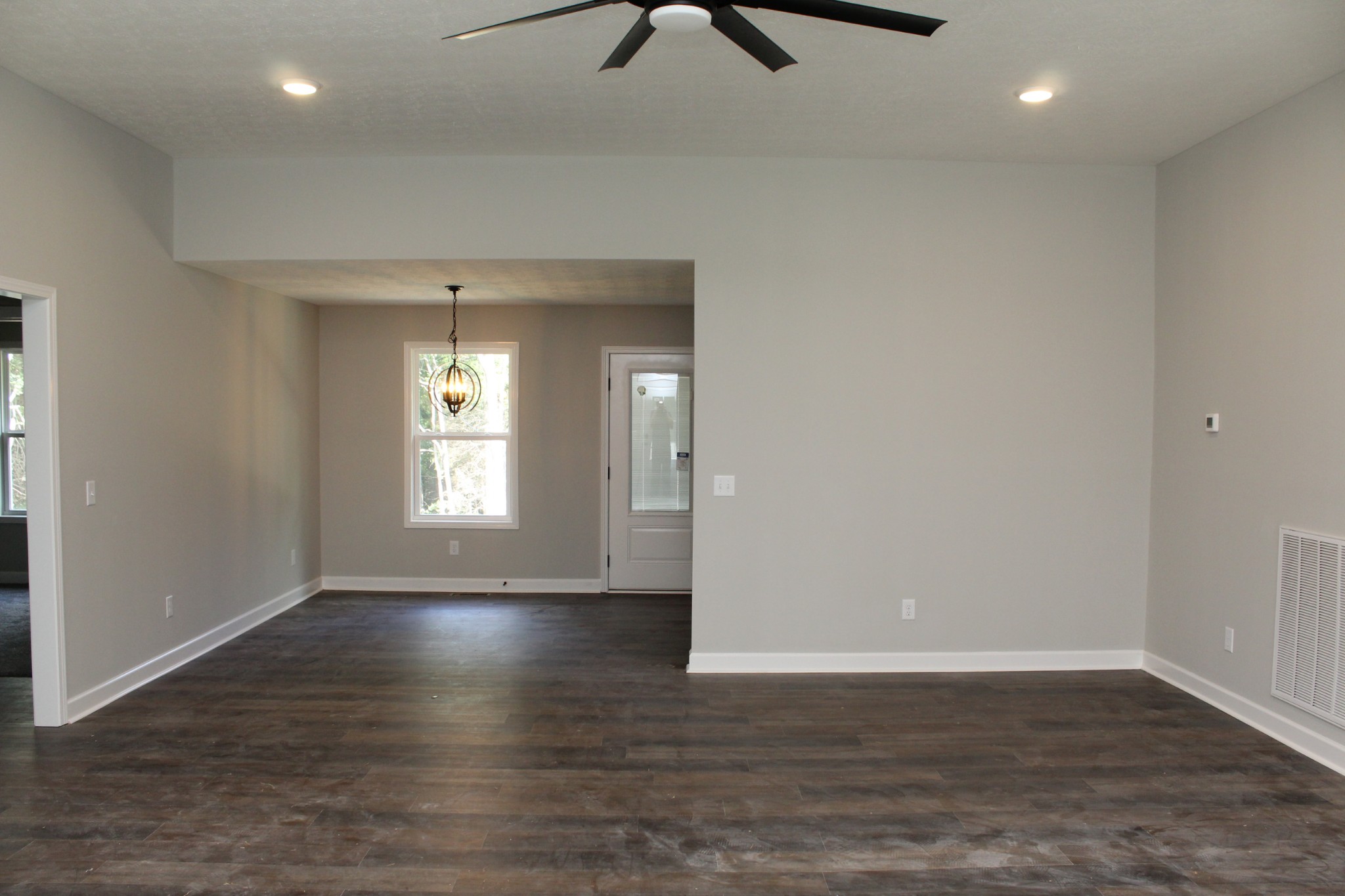 3835 Union Camp Road Lafayette, TN 37083 - Photo 9 of 27 an empty room with wooden floor and windows