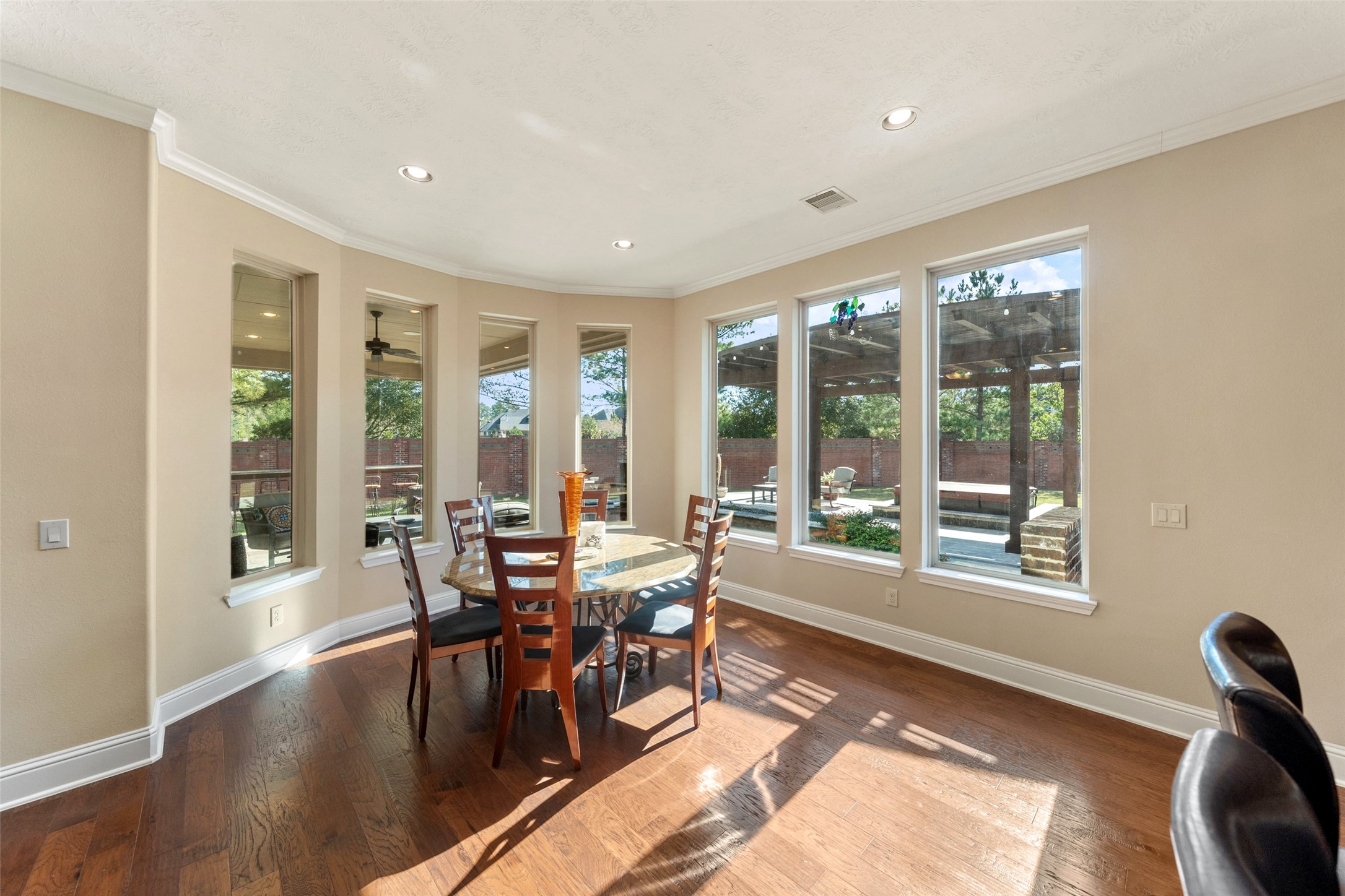 27626 South Colt Shadow Lane Spring, TX 77386 - Photo 13 of 50 a view of a dining room with furniture window and wooden floor