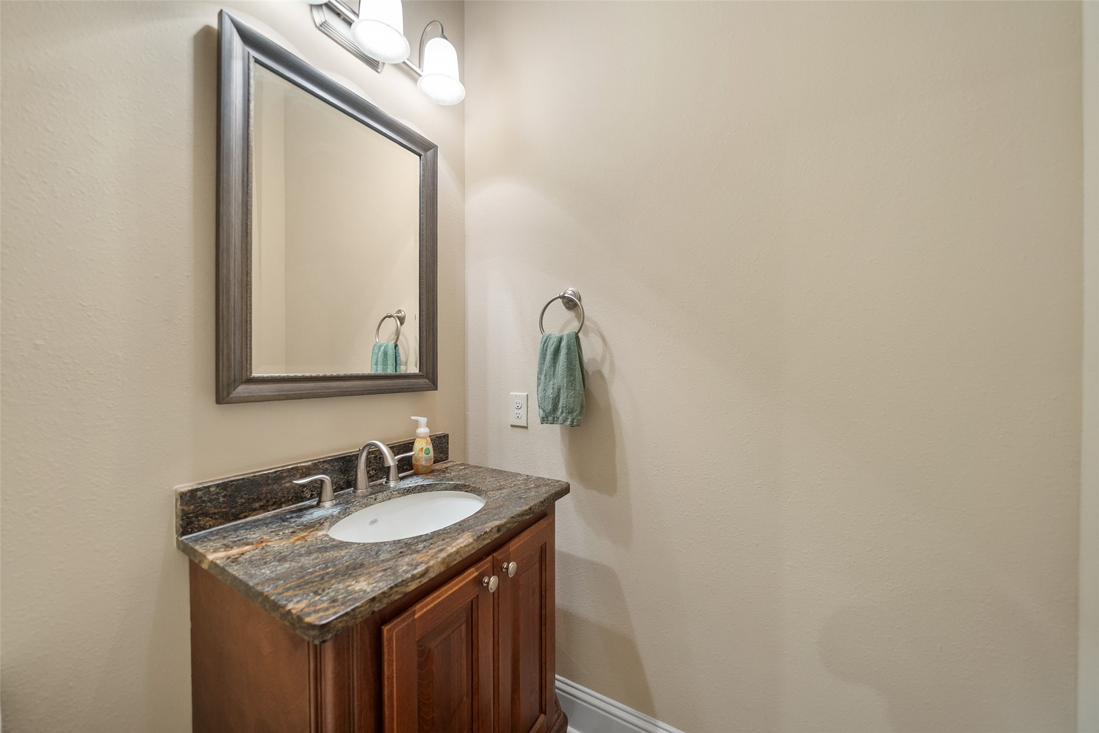 27626 South Colt Shadow Lane Spring, TX 77386 - Photo 16 of 50 a bathroom with a granite countertop sink and a mirror
