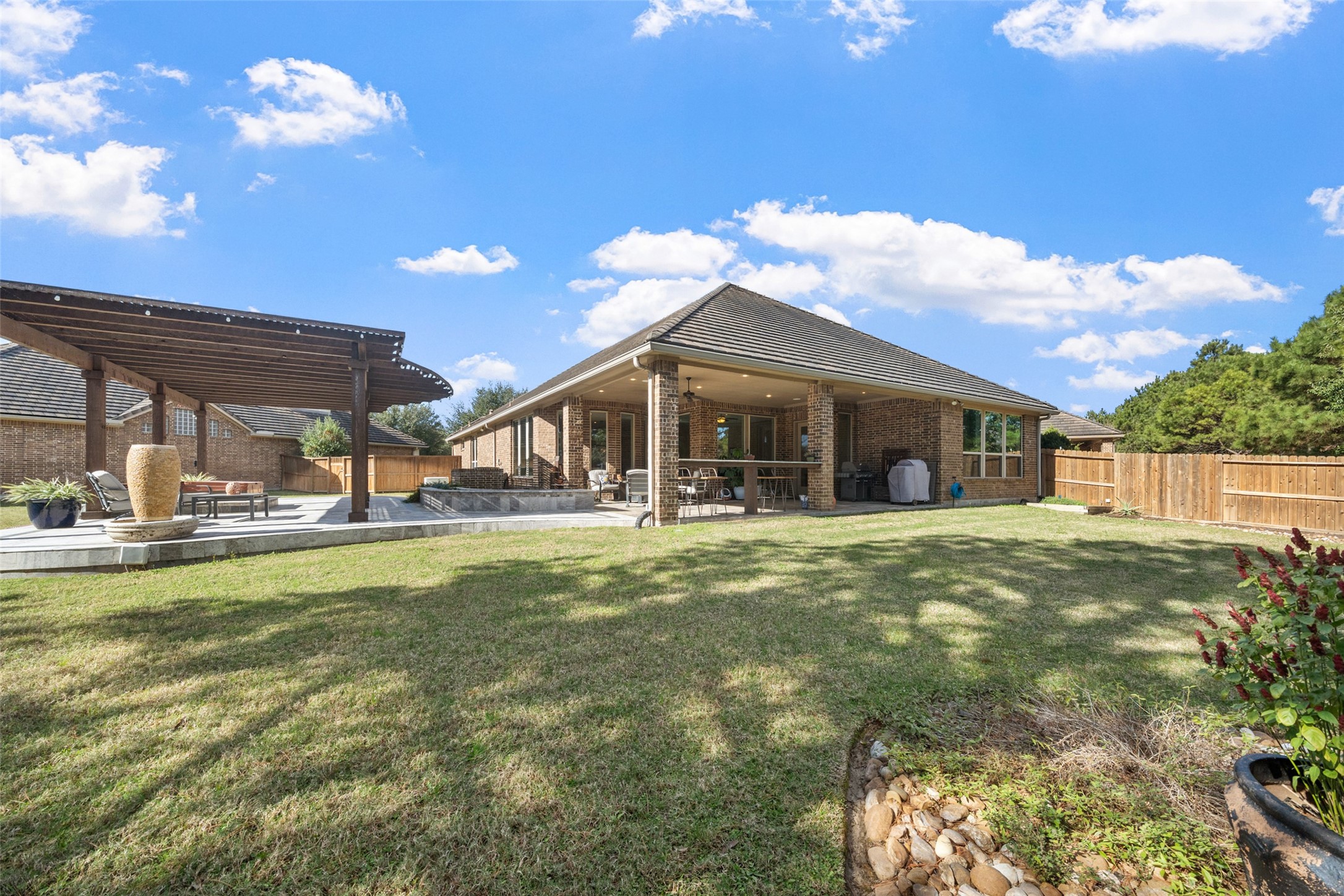 27626 South Colt Shadow Lane Spring, TX 77386 - Photo 2 of 50 a front view of house with yard barbeque and outdoor seating