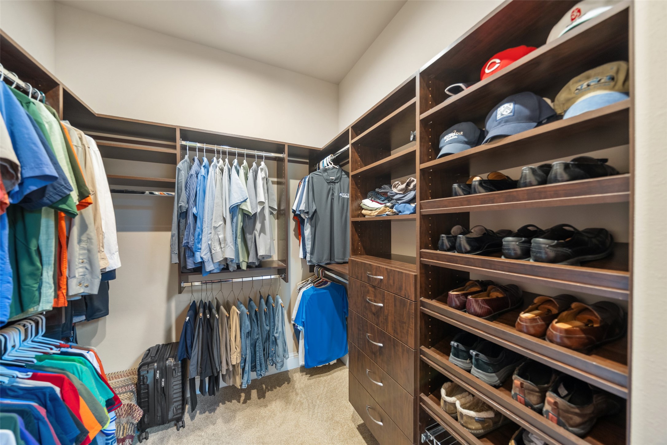 27626 South Colt Shadow Lane Spring, TX 77386 - Photo 22 of 50 a view of walk in closet with clothes and shoes