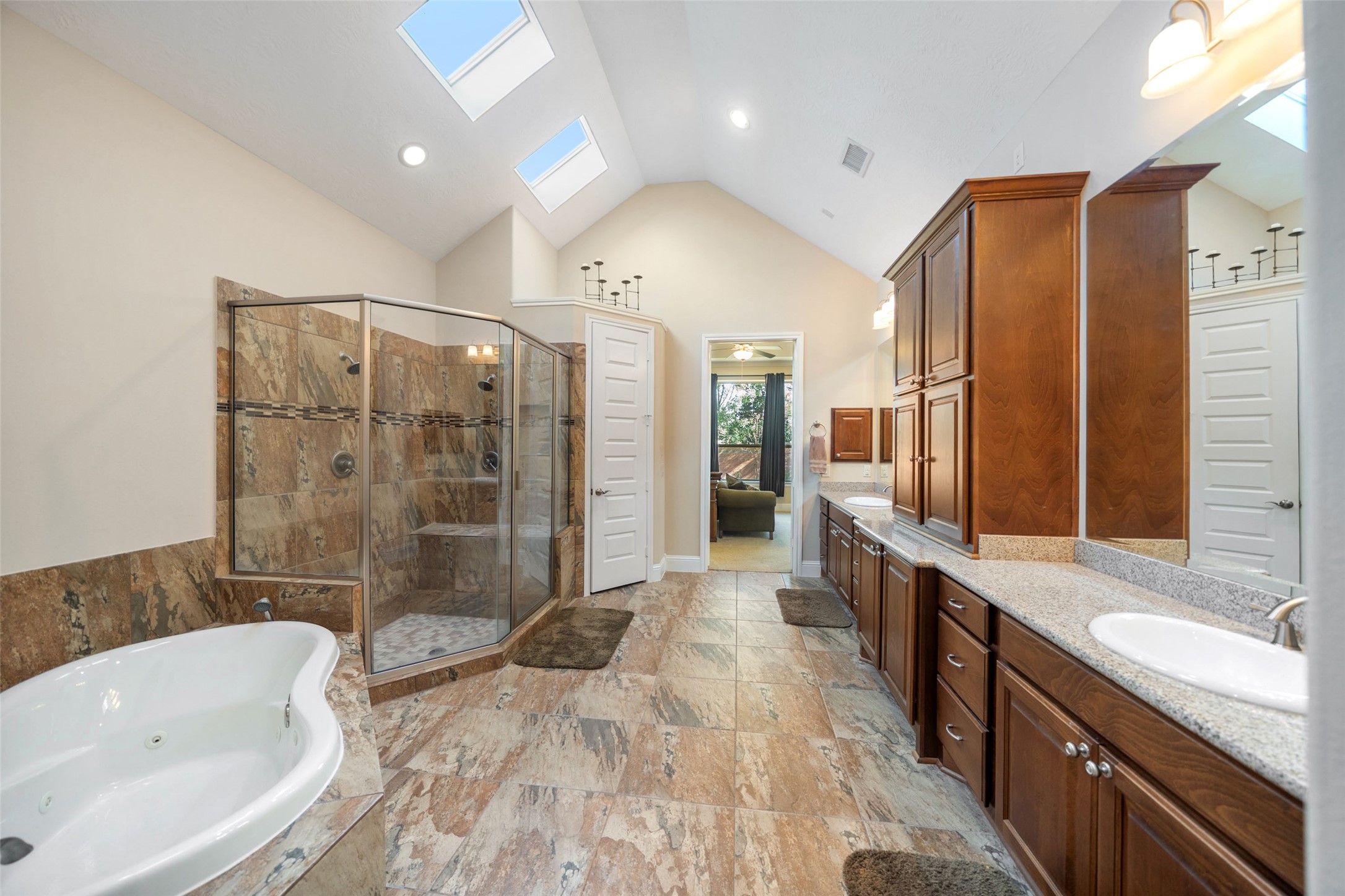 27626 South Colt Shadow Lane Spring, TX 77386 - Photo 24 of 50 a bathroom with a bathtub shower sink mirror and toilet