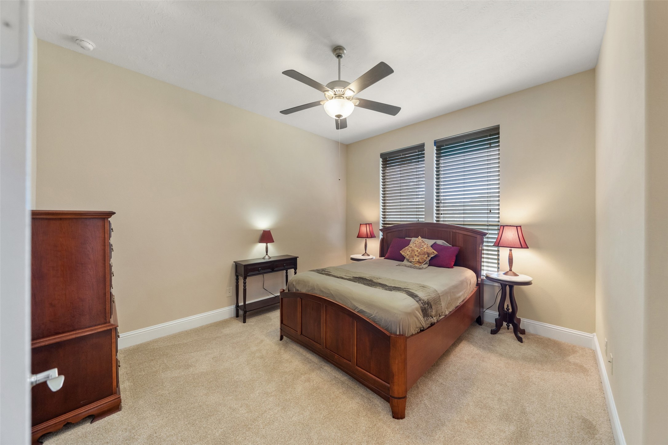 27626 South Colt Shadow Lane Spring, TX 77386 - Photo 30 of 50 a bedroom with a bed and a chandelier