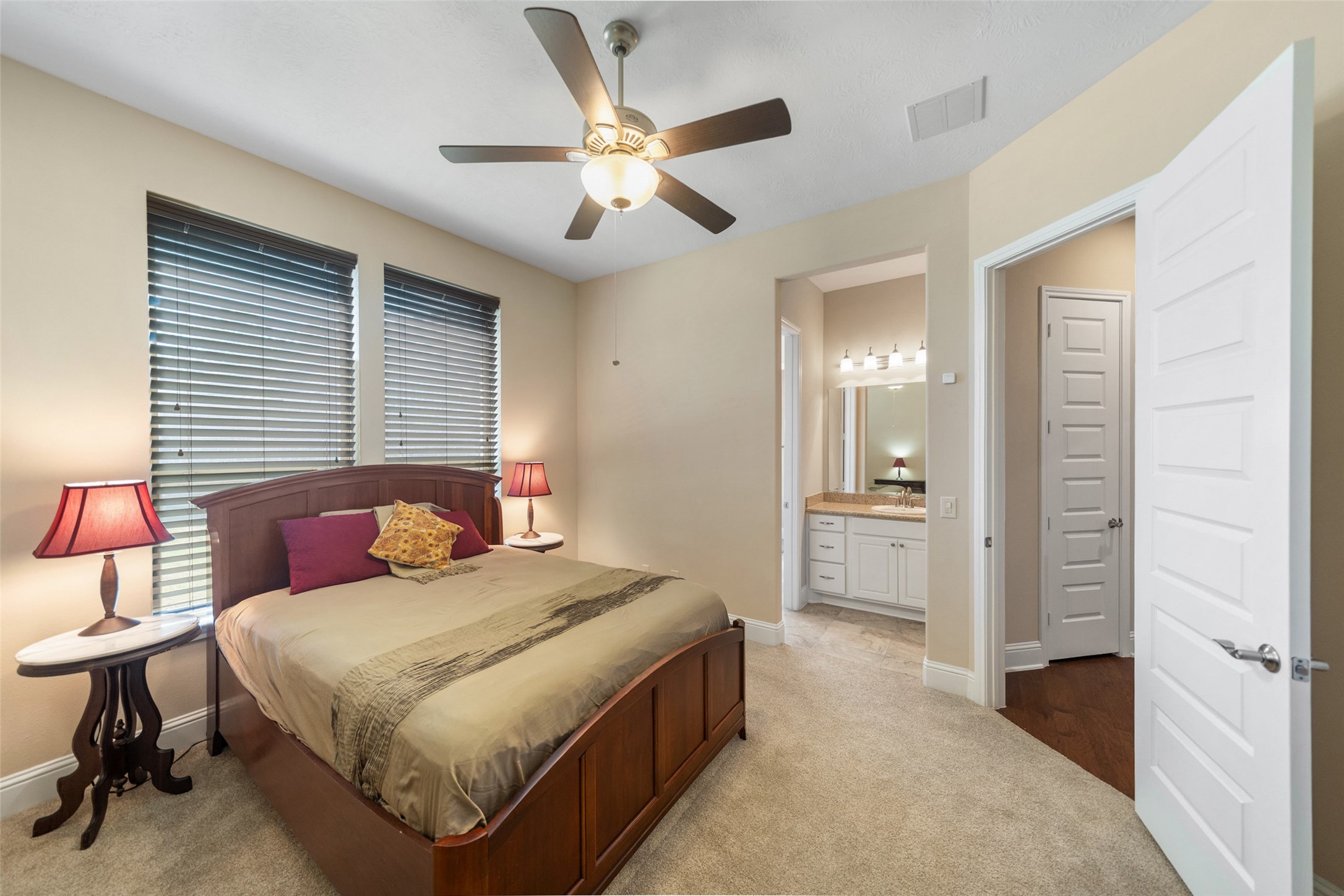 27626 South Colt Shadow Lane Spring, TX 77386 - Photo 32 of 50 a bedroom with a bed and a chandelier