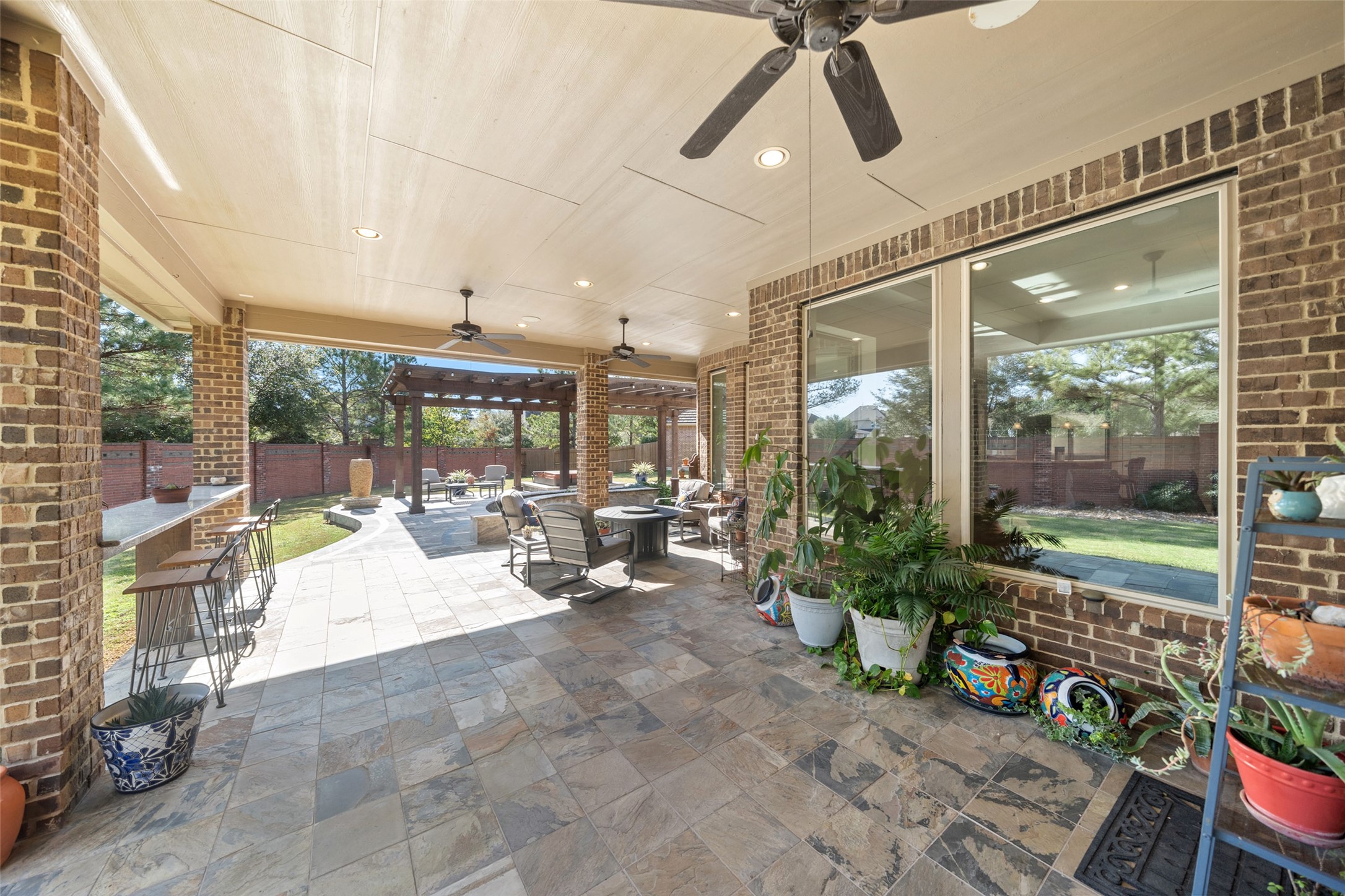 27626 South Colt Shadow Lane Spring, TX 77386 - Photo 36 of 50 a building outdoor space with patio furniture and potted plants