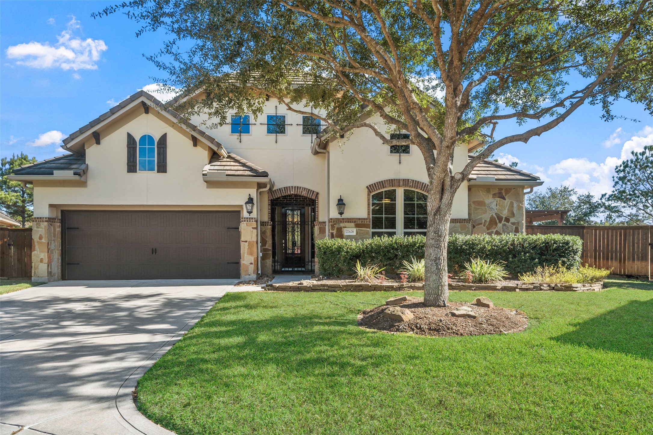 27626 South Colt Shadow Lane Spring, TX 77386 - Photo 48 of 50 a front view of house with yard and green space