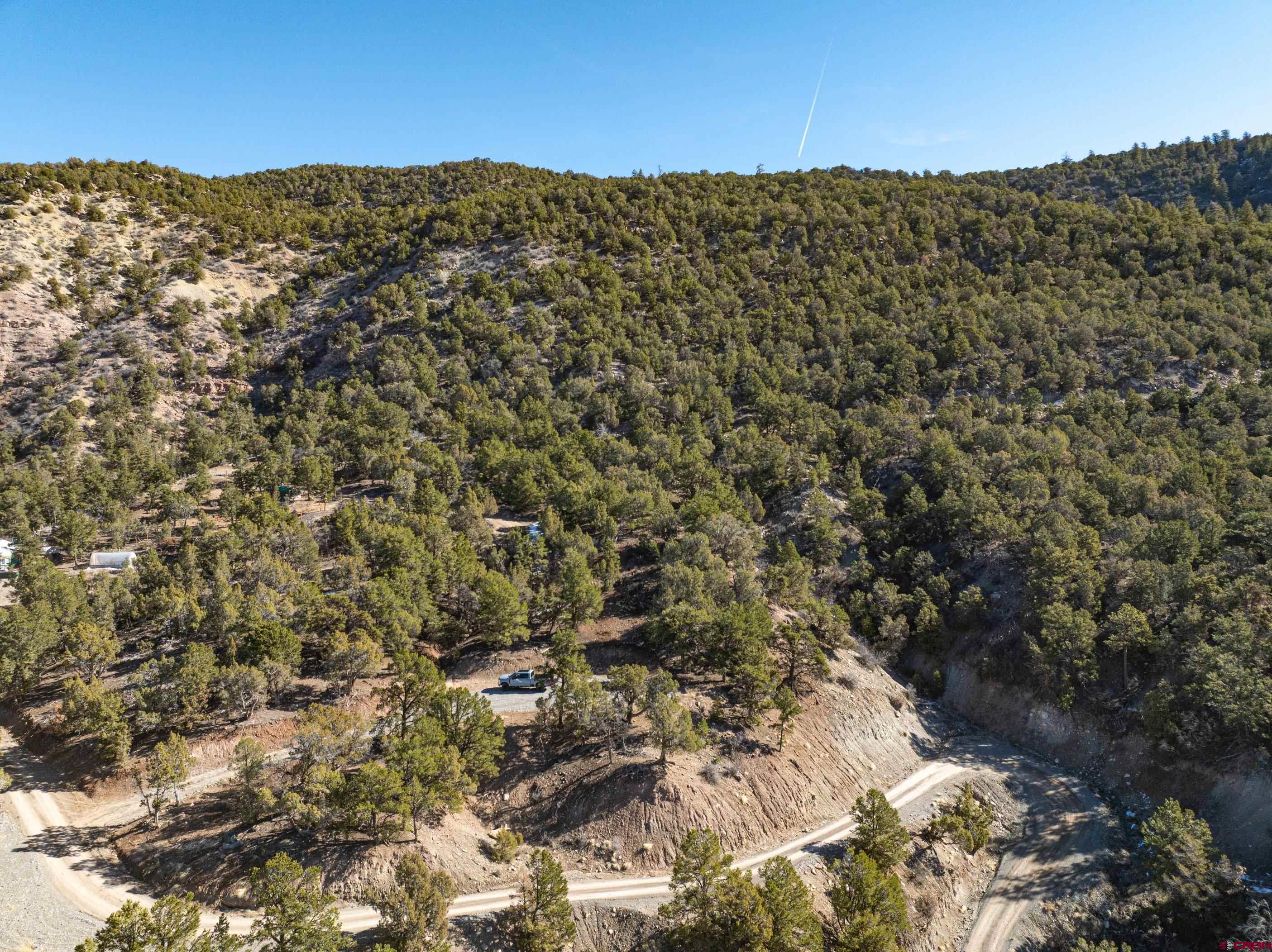 Tbd Elsie Trail Ridgway, CO 81432 - Photo 12 of 35 a view of a large building with mountains in the background