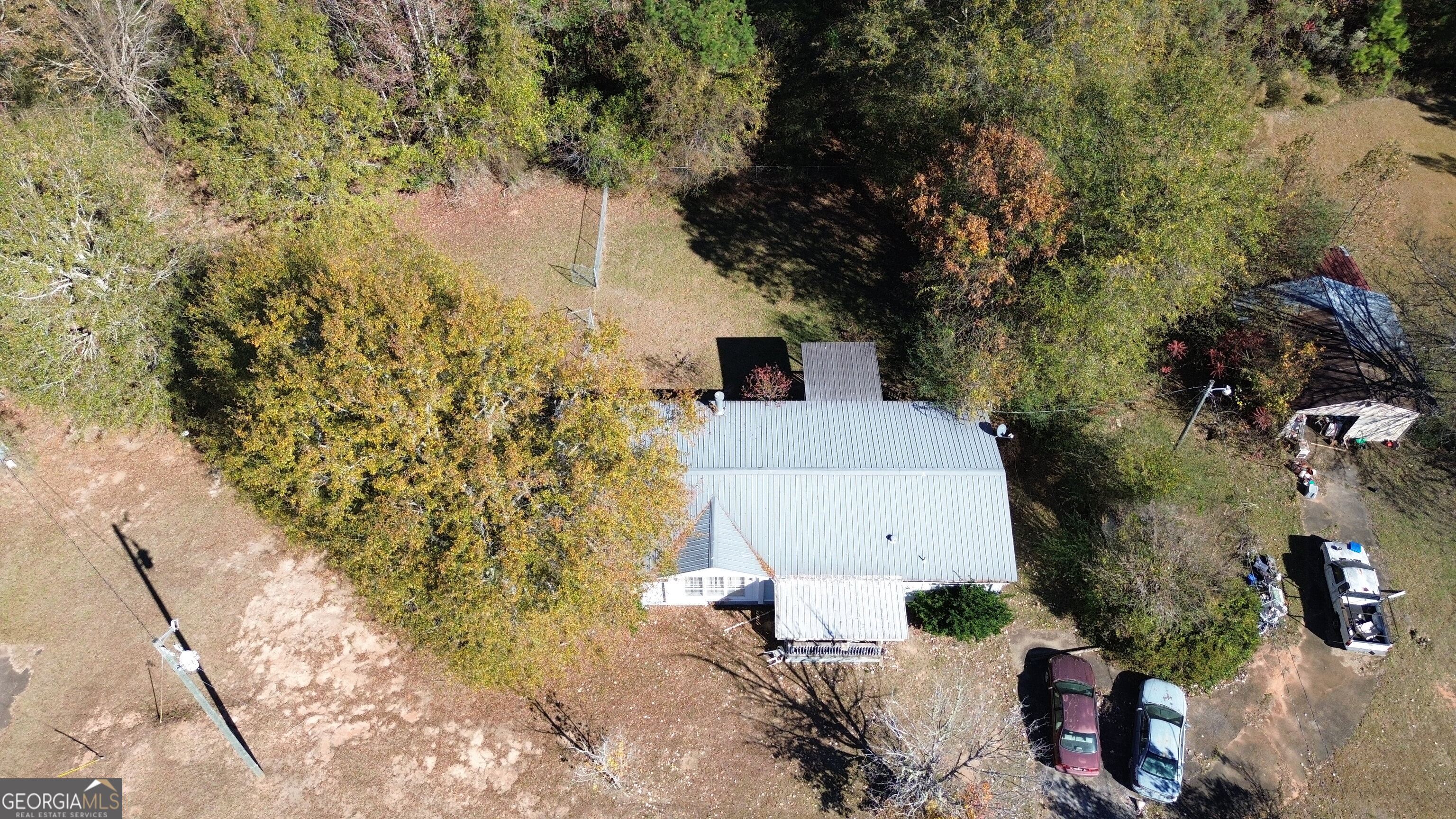 6326 Riggins Mill Road Dry Branch, GA 31020 - Photo 102 of 108 an aerial view of house with yard and mountain view in back