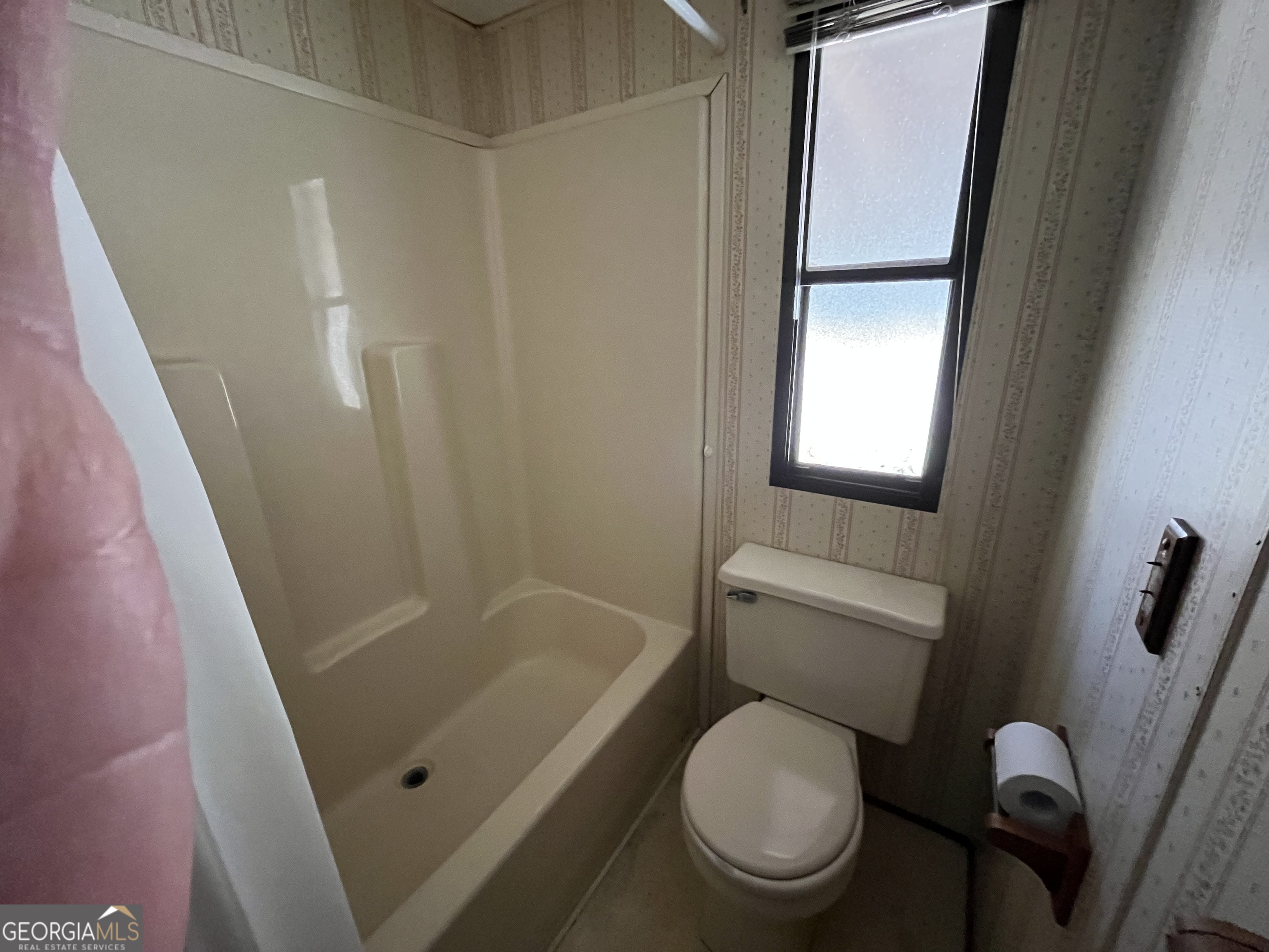 6326 Riggins Mill Road Dry Branch, GA 31020 - Photo 12 of 108 a white toilet sitting next to a bath tub