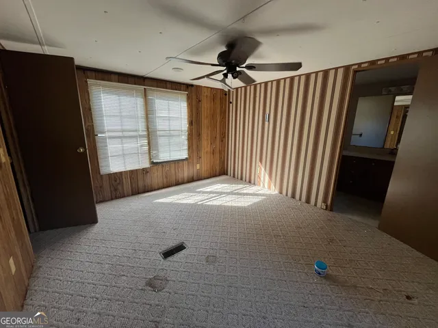 a room with gym equipment and a window