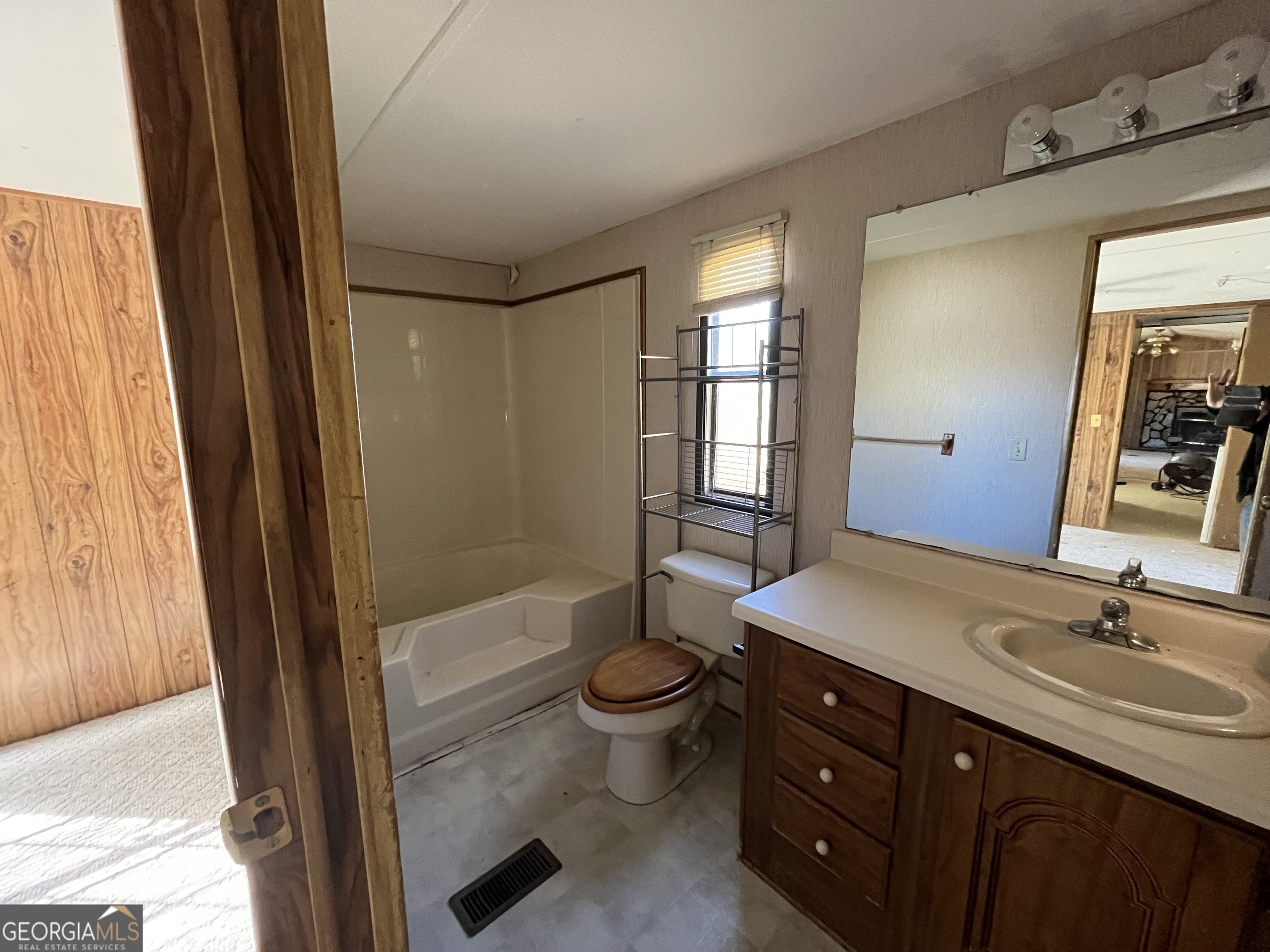 6326 Riggins Mill Road Dry Branch, GA 31020 - Photo 15 of 108 a bathroom with a sink a toilet and shower