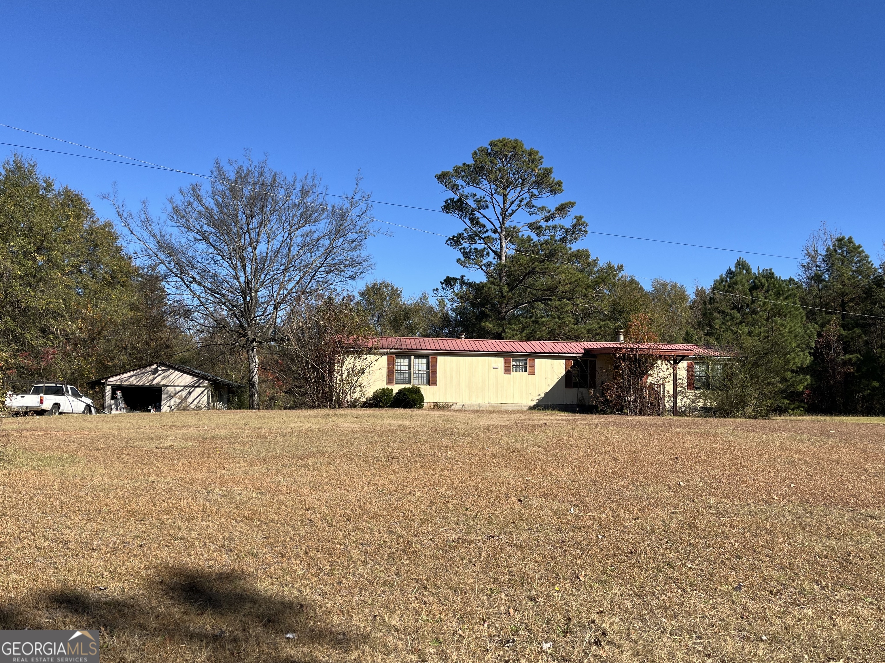 6326 Riggins Mill Road Dry Branch, GA 31020 - Photo 2 of 108 a view of an outdoor space and a lake view