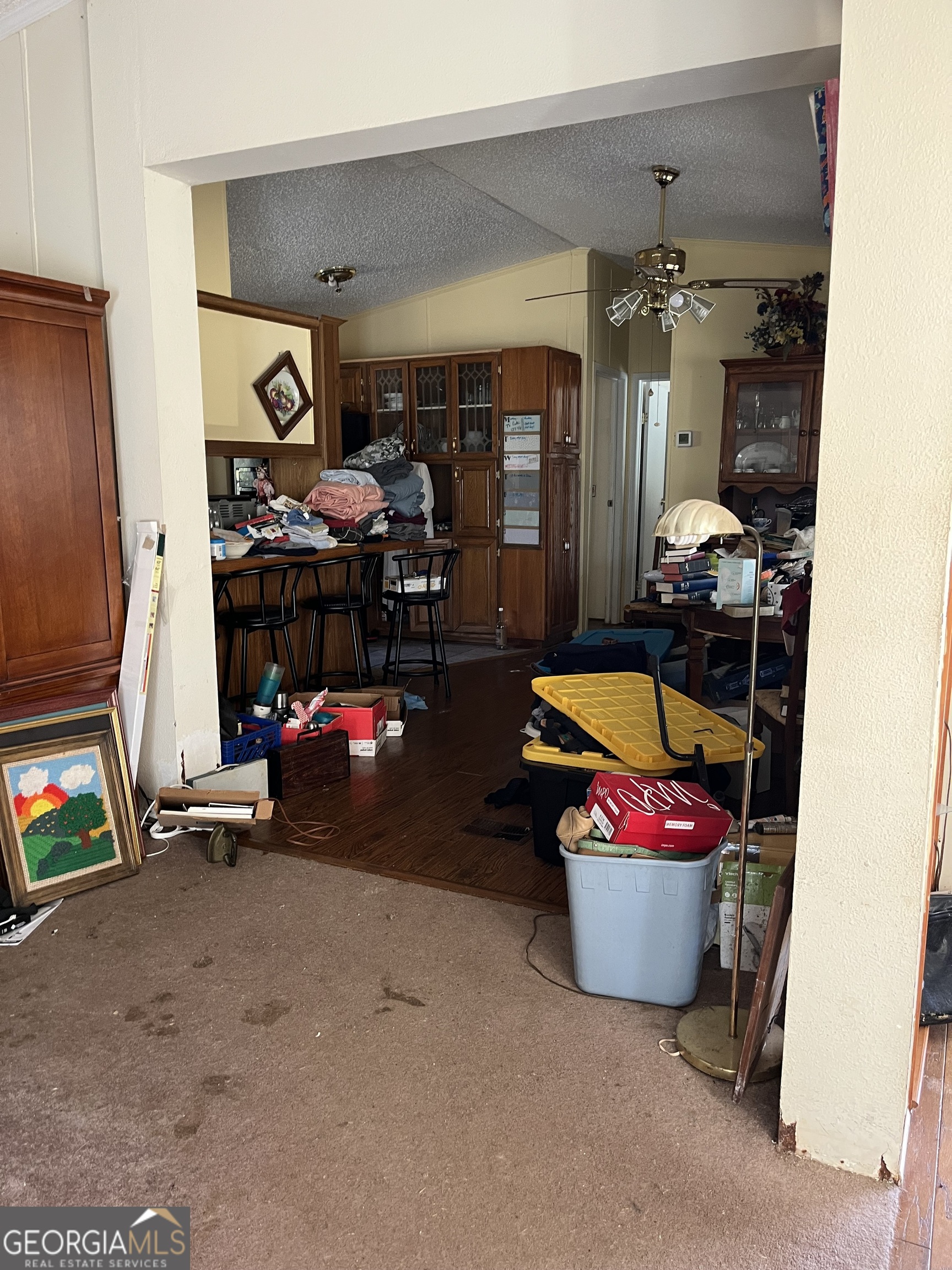 6326 Riggins Mill Road Dry Branch, GA 31020 - Photo 27 of 108 a living room with furniture and a fireplace