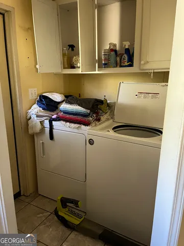 a room with furniture a rug and a window