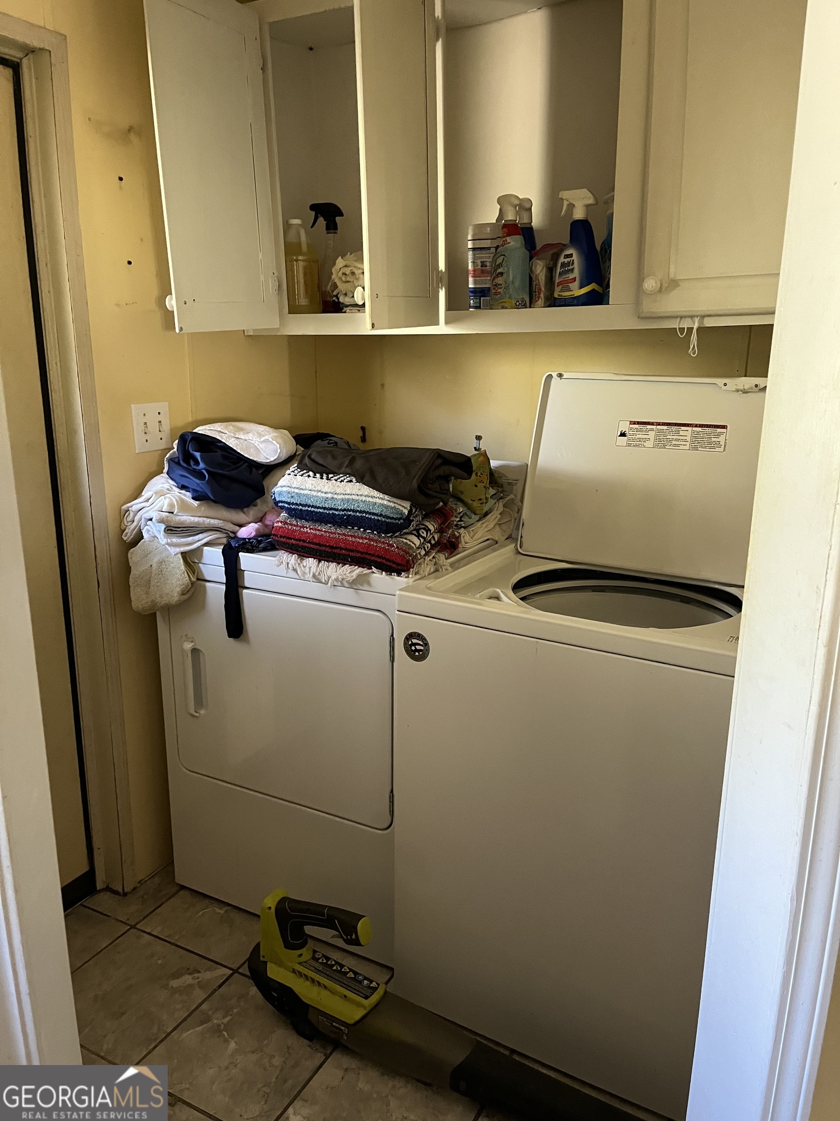 6326 Riggins Mill Road Dry Branch, GA 31020 - Photo 34 of 108 a bathroom with a sink and a mirror