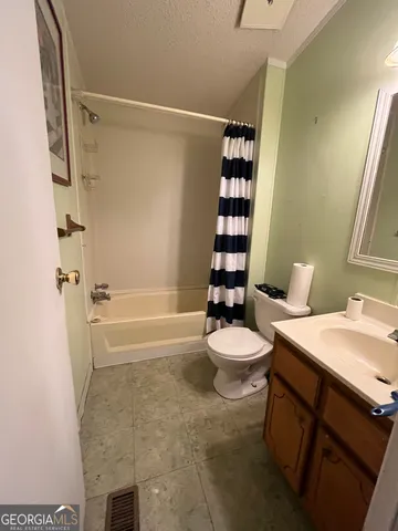 a room with furniture a window and gym equipment