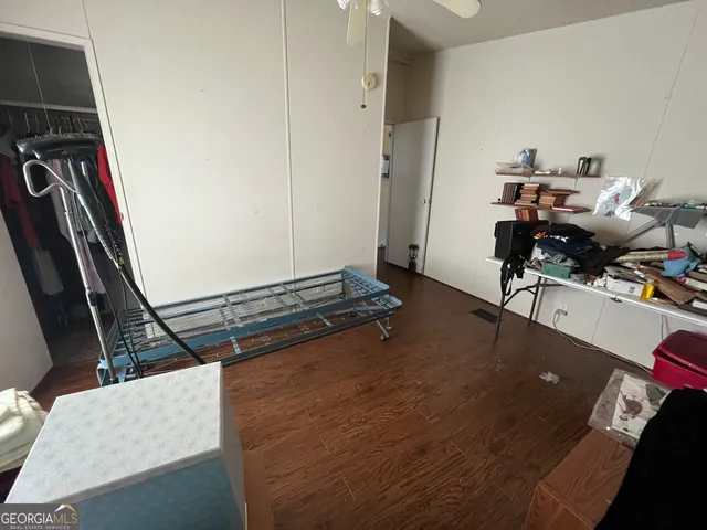 a living room with furniture a window and gym equipment