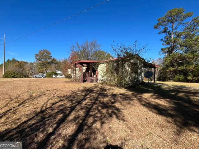 a view of a yard with a tree