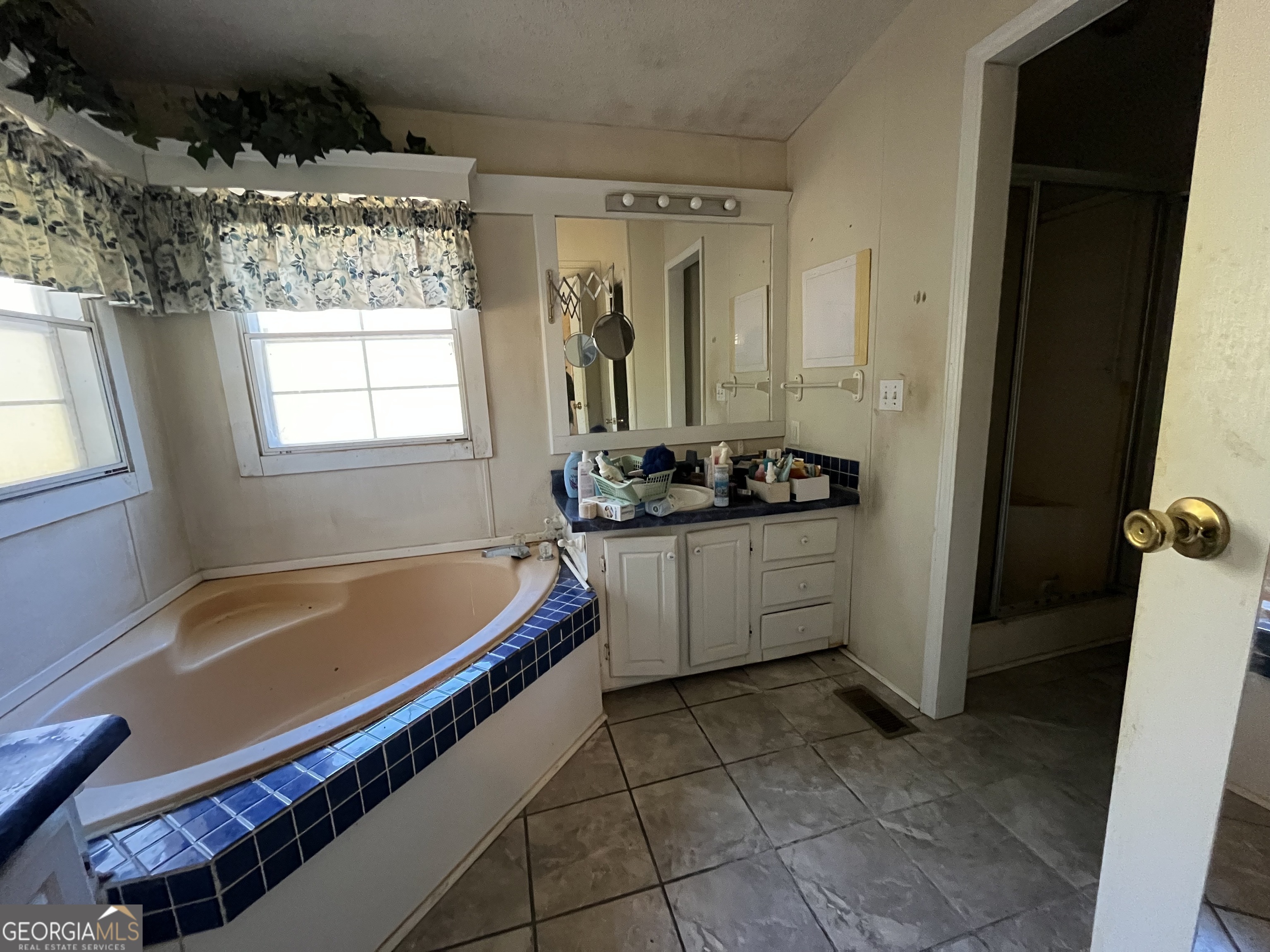 6326 Riggins Mill Road Dry Branch, GA 31020 - Photo 45 of 108 a kitchen with a sink and cabinets