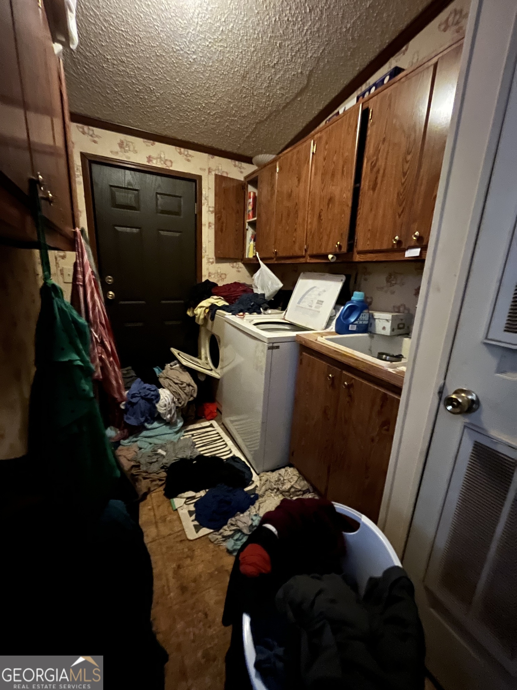 6326 Riggins Mill Road Dry Branch, GA 31020 - Photo 71 of 108 a view of a room with storage and utility