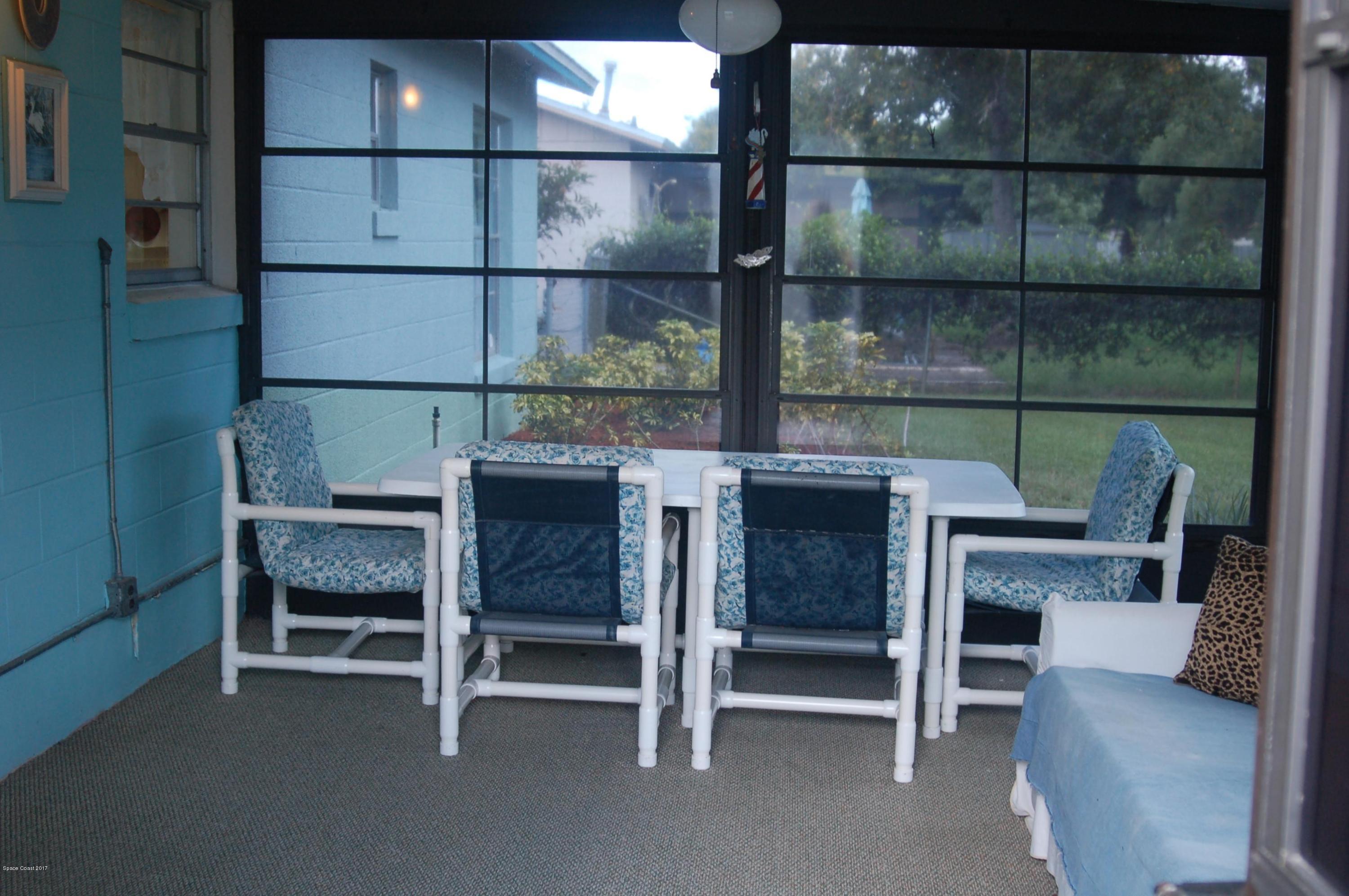 1557 West Powder Horn Road Titusville, FL 32796 - Photo 16 of 20 Screened Porch