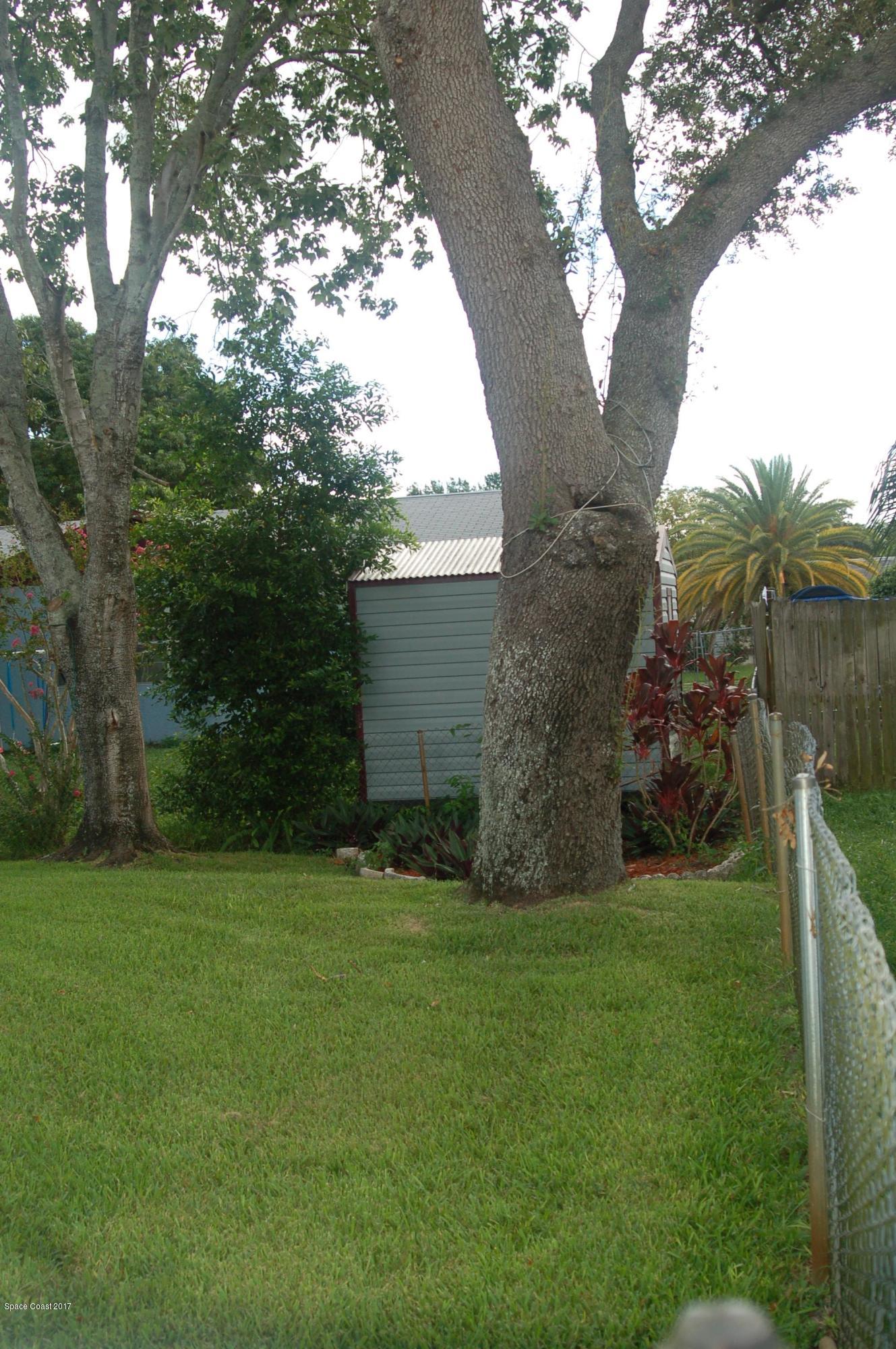 1557 West Powder Horn Road Titusville, FL 32796 - Photo 17 of 20 Side Back Yard