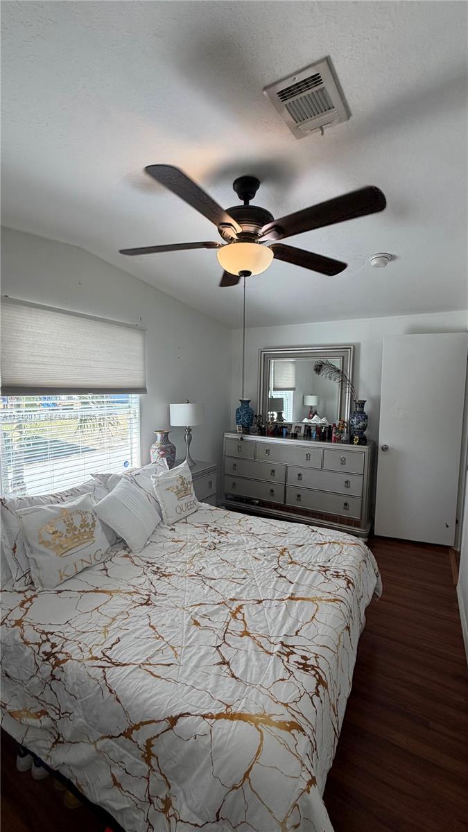 25345 Southwest 129th Place Homestead, FL 33032 - Photo 11 of 35 a bedroom with a large bed and a large window