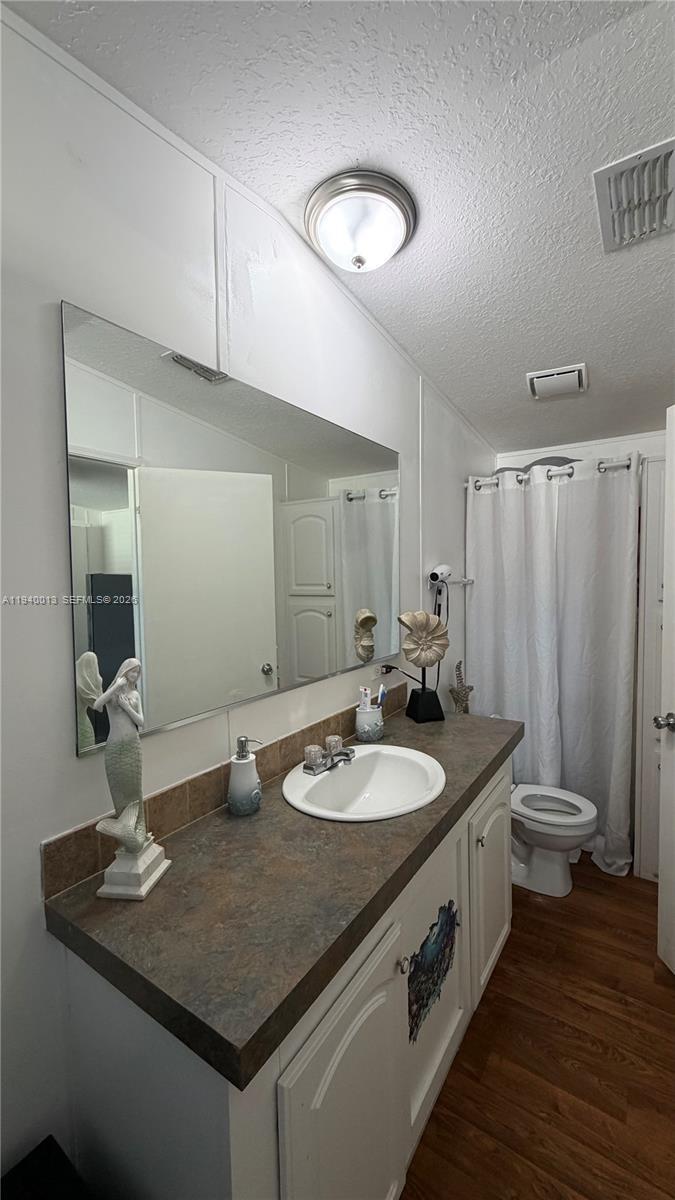 25345 Southwest 129th Place Homestead, FL 33032 - Photo 19 of 35 a bathroom with a double vanity sink and a mirror