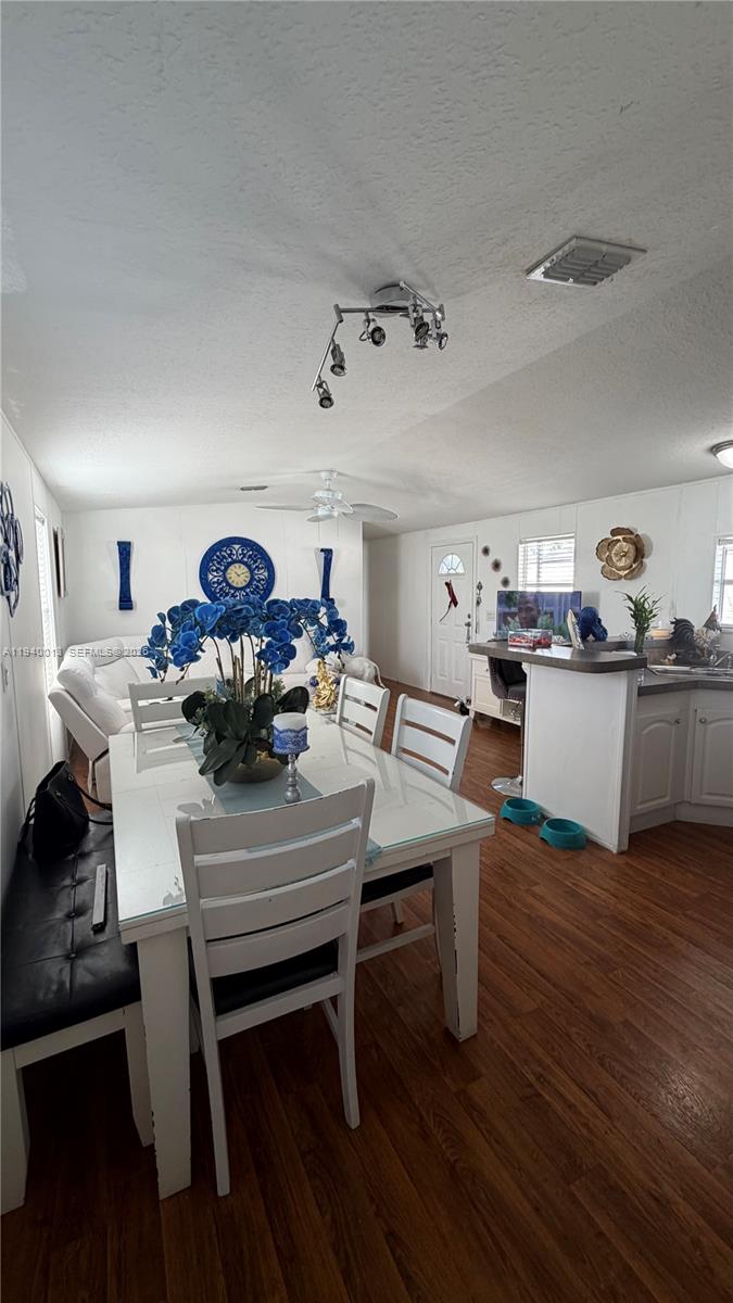 25345 Southwest 129th Place Homestead, FL 33032 - Photo 24 of 35 a living room with furniture and wooden floor