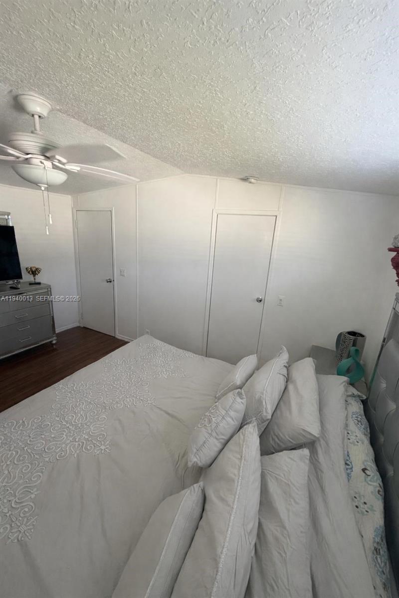 25345 Southwest 129th Place Homestead, FL 33032 - Photo 32 of 35 a bed room with a bed