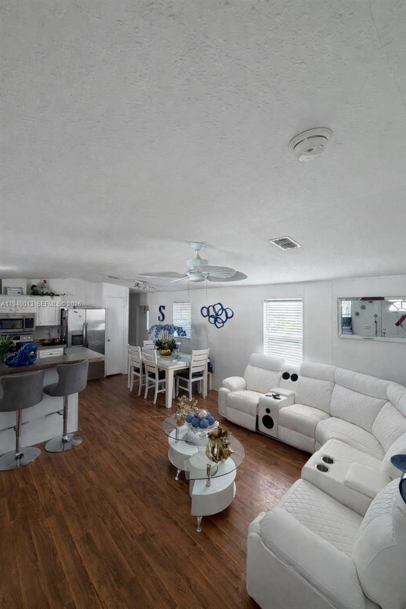 25345 Southwest 129th Place Homestead, FL 33032 - Photo 33 of 35 a living room with furniture and a wooden floor