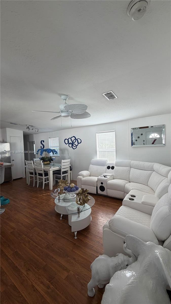 25345 Southwest 129th Place Homestead, FL 33032 - Photo 7 of 35 a living room with furniture and wooden floor