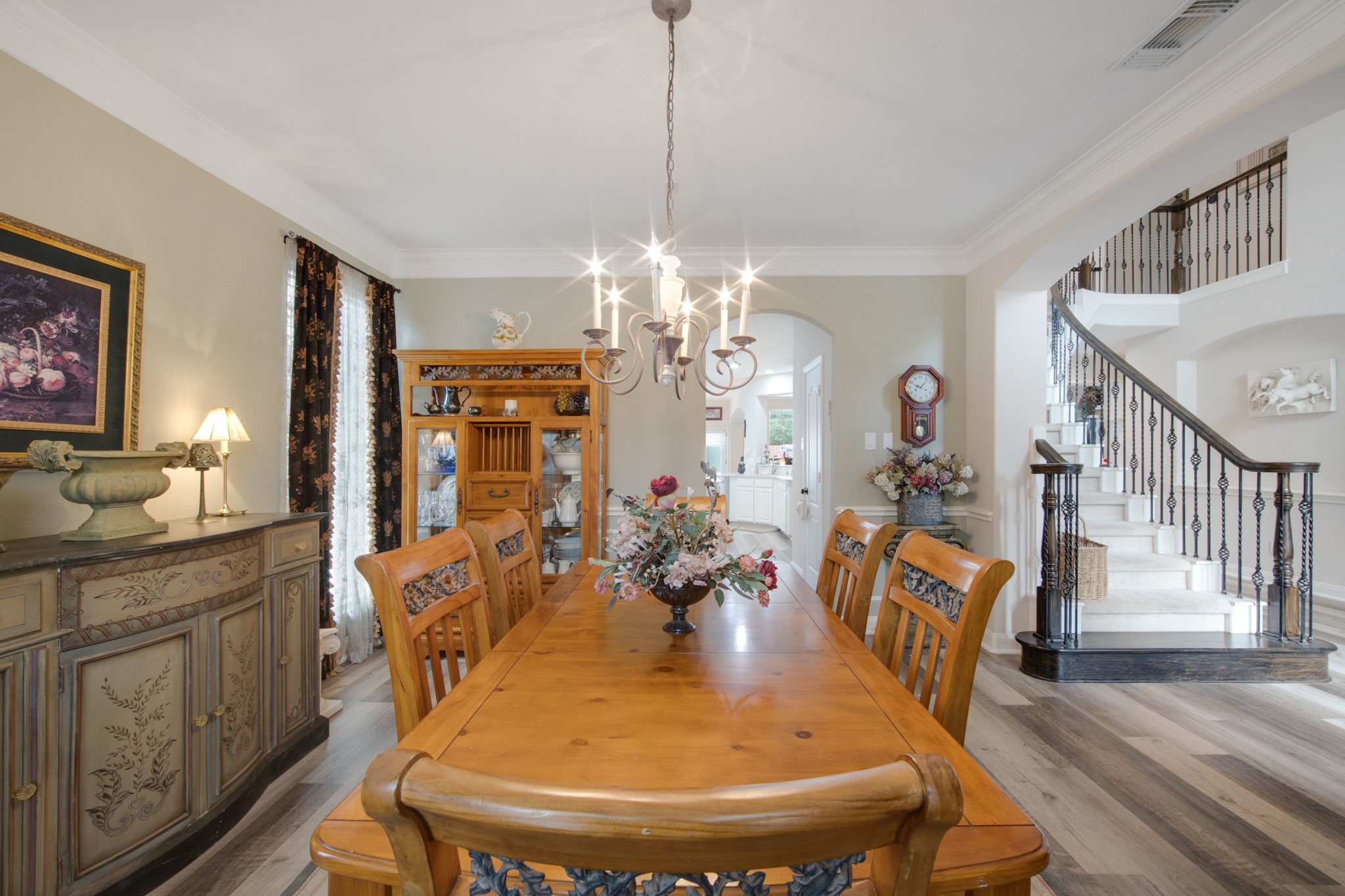 9510 Ashdown Forest Drive Spring, TX 77379 - Photo 11 of 50 a dining room with furniture a chandelier and wooden floor