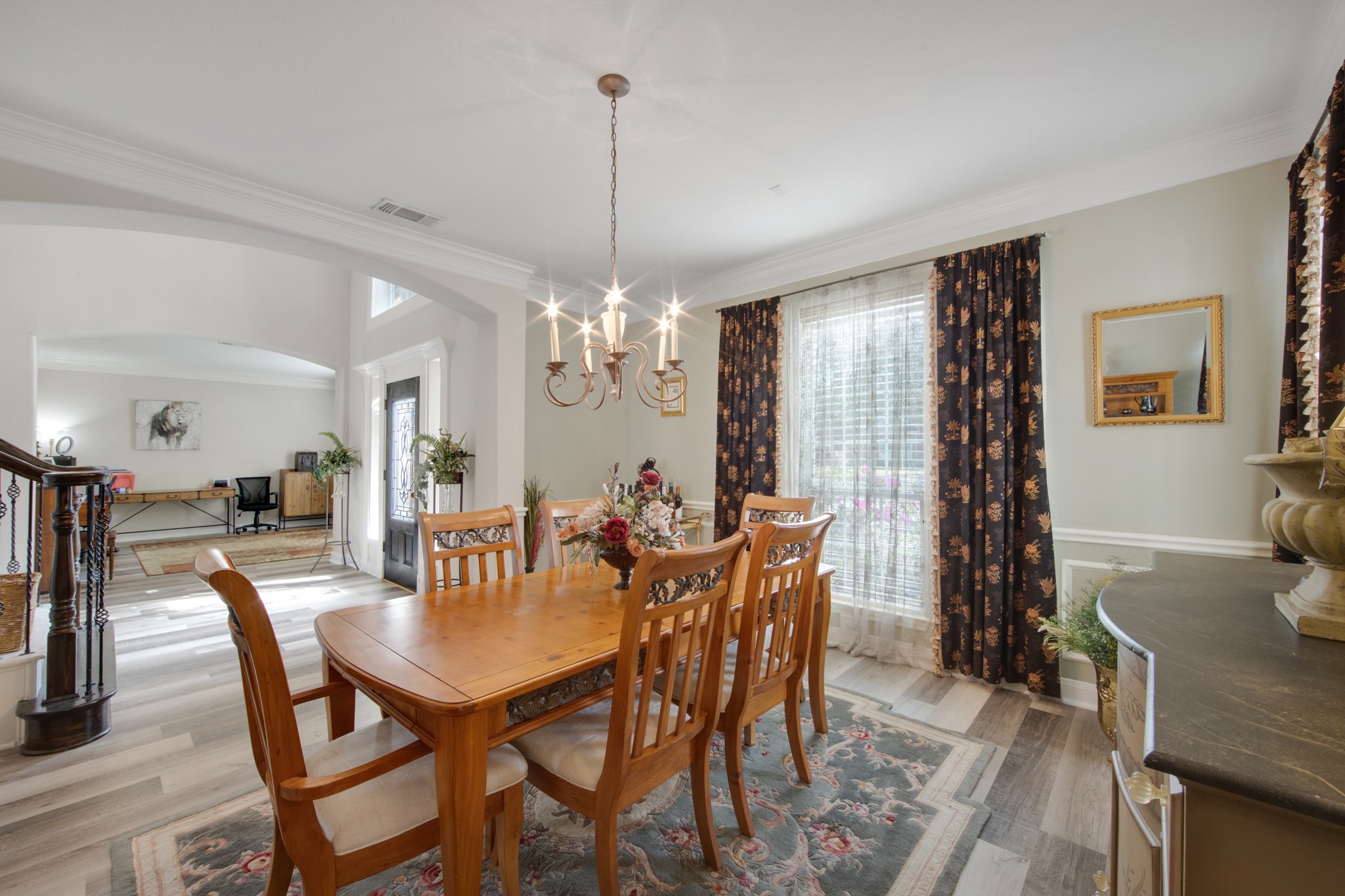 9510 Ashdown Forest Drive Spring, TX 77379 - Photo 12 of 50 a view of a dining room with furniture window and wooden floor