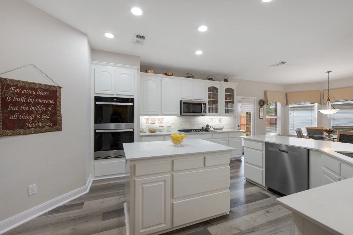 9510 Ashdown Forest Drive Spring, TX 77379 - Photo 16 of 50 KITCHEN – spacious kitchen overlooking the breakfast area with large windows bringing in natural light. This inviting space is perfect for everyday living and casual gatherings.