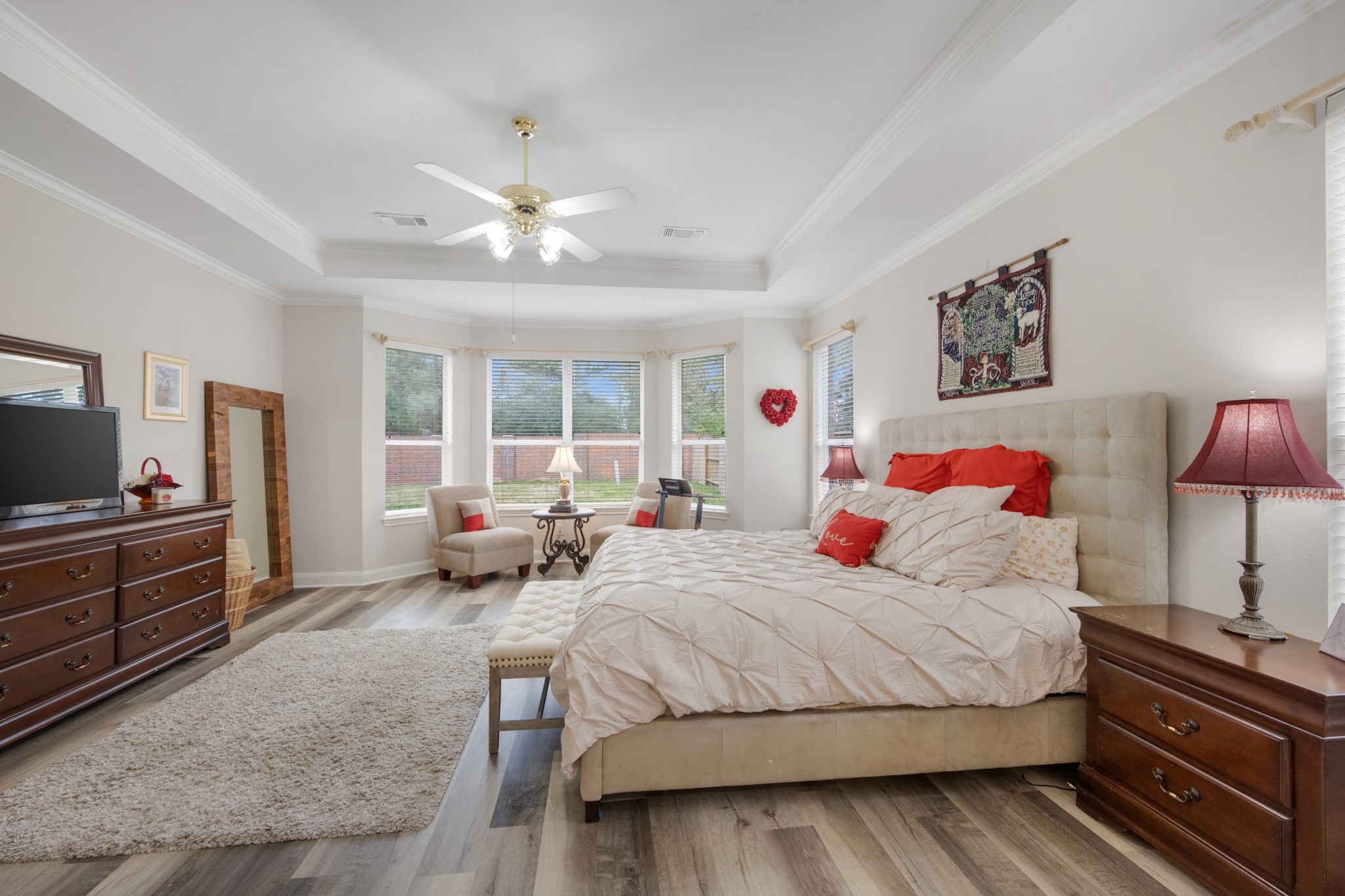 9510 Ashdown Forest Drive Spring, TX 77379 - Photo 25 of 50 a bedroom with a bed and a chandelier