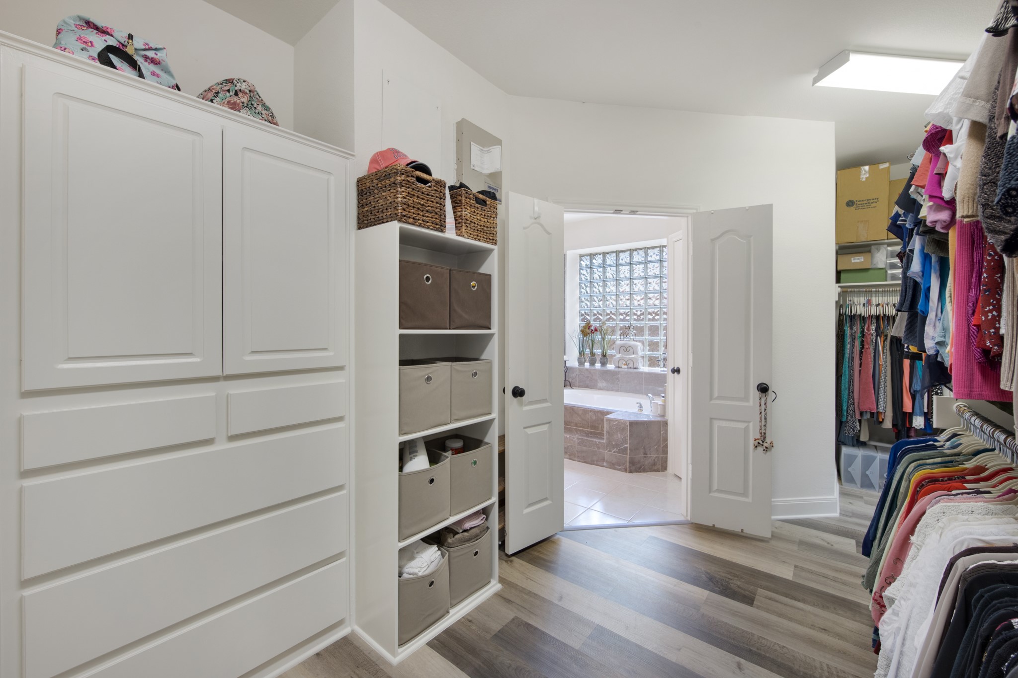 9510 Ashdown Forest Drive Spring, TX 77379 - Photo 29 of 50 a view of walk in closet with clothes and shoes