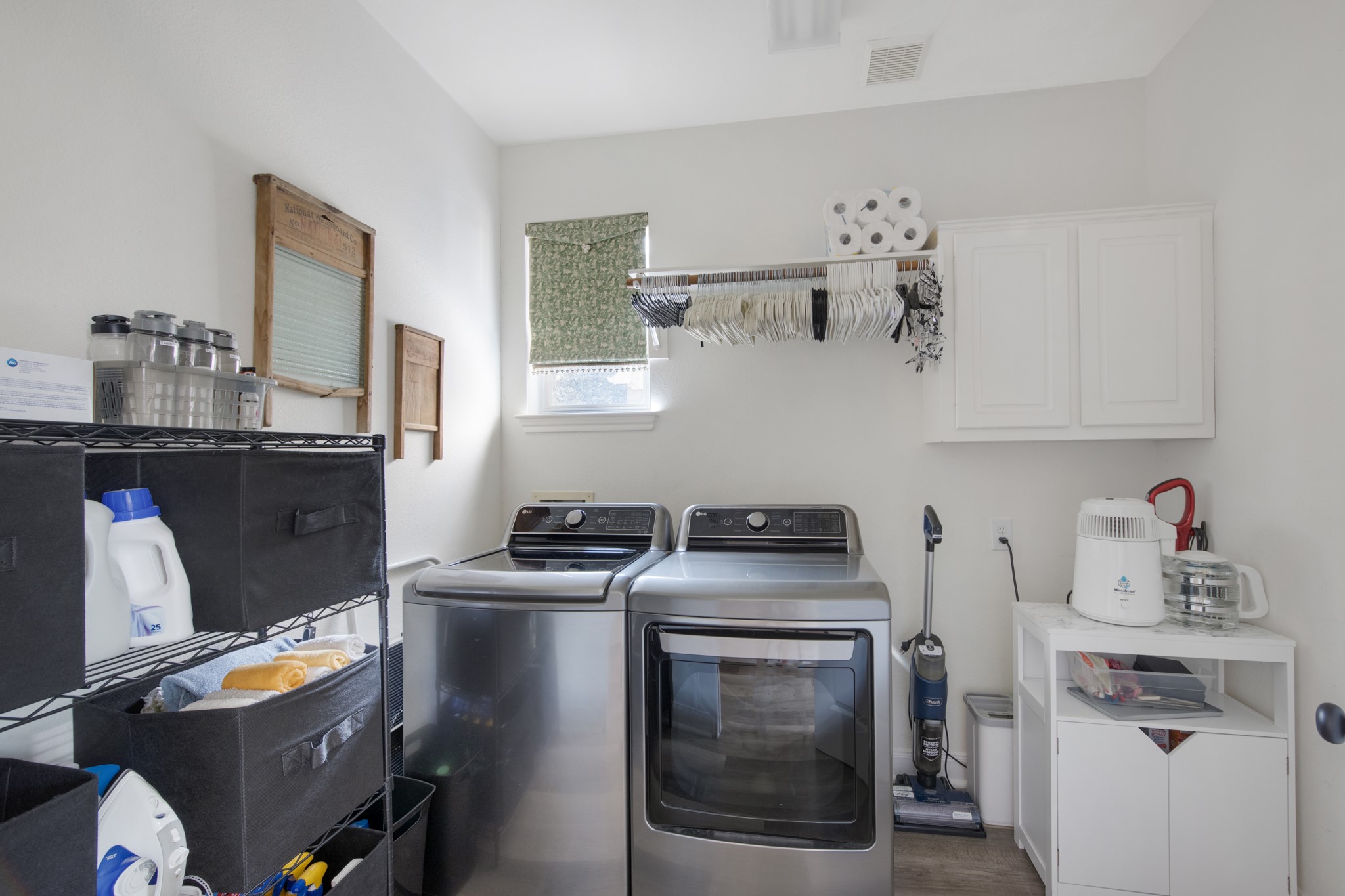 9510 Ashdown Forest Drive Spring, TX 77379 - Photo 30 of 50 a kitchen with a stove and a refrigerator