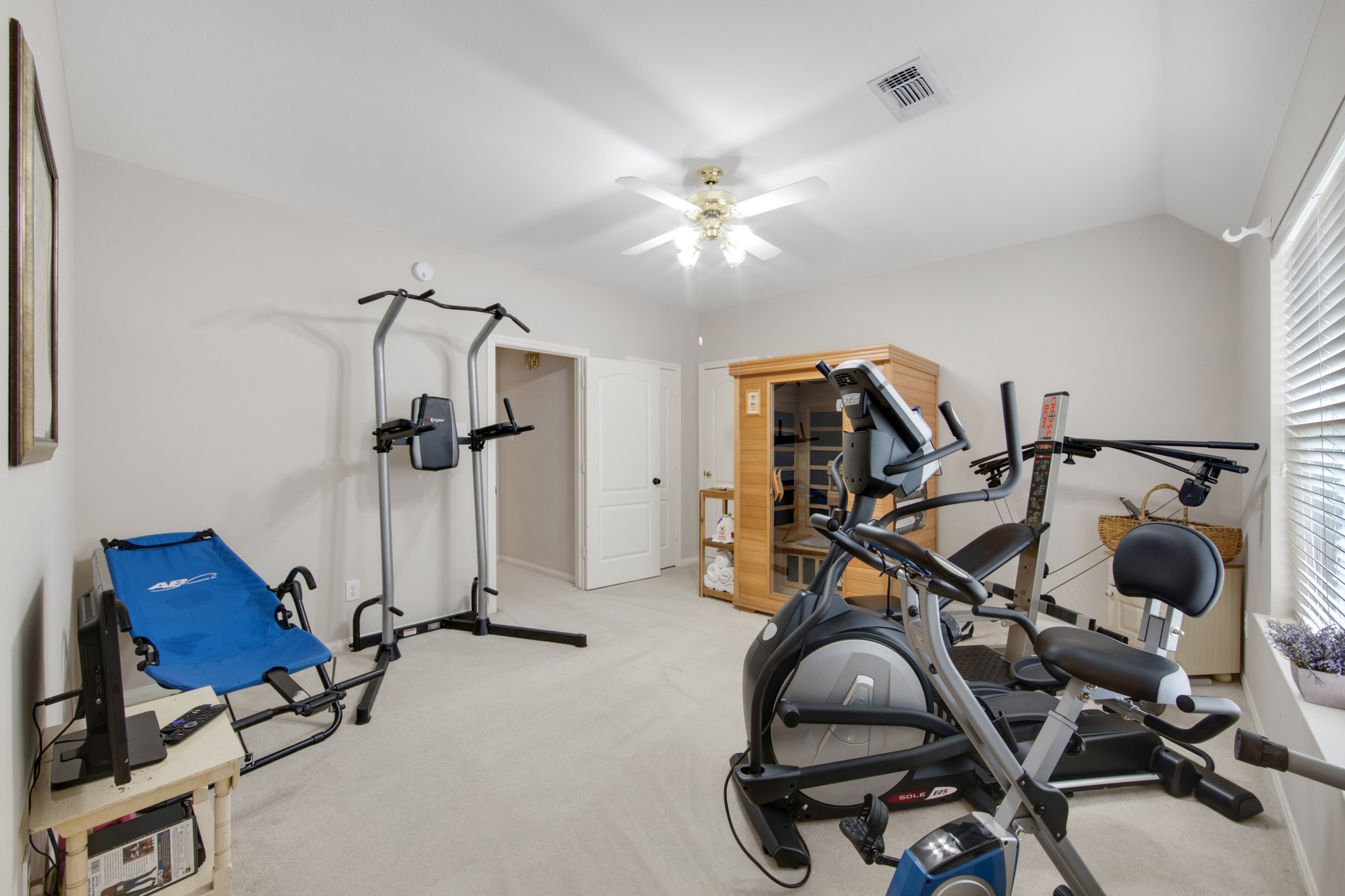 9510 Ashdown Forest Drive Spring, TX 77379 - Photo 36 of 50 BEDROOM 3 – versatile upstairs bedroom currently used as a home workout space. The room offers plenty of space and flexibility for a bedroom, gym, or hobby room.