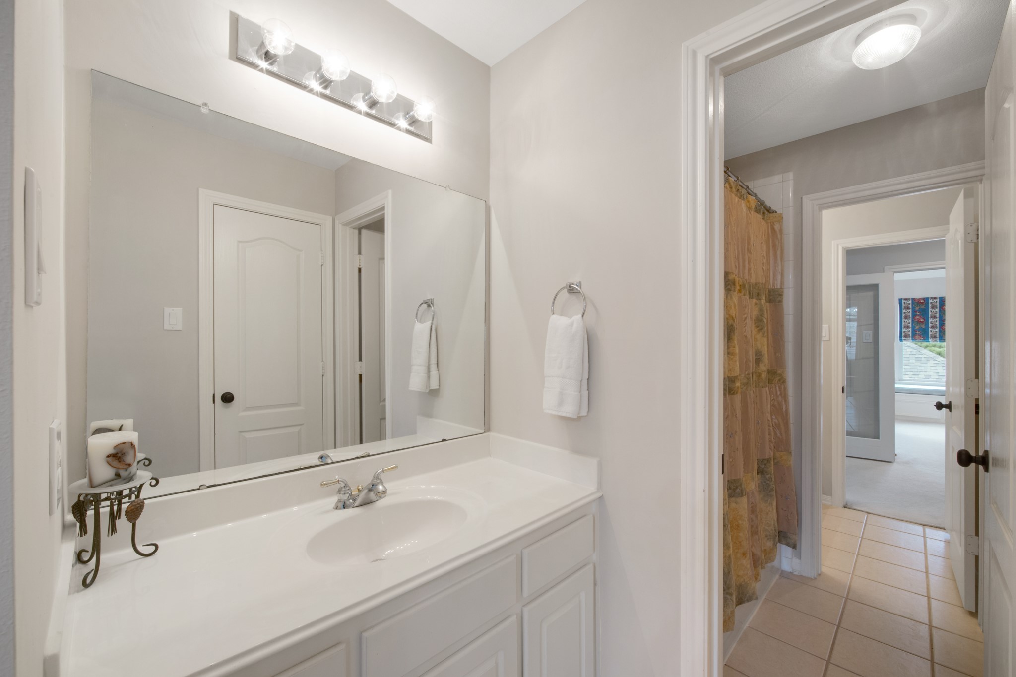 9510 Ashdown Forest Drive Spring, TX 77379 - Photo 38 of 50 JACK AND JILL BATHROOM #2 – second upstairs bathroom featuring a large vanity, ample lighting, and convenient access from the bedrooms.