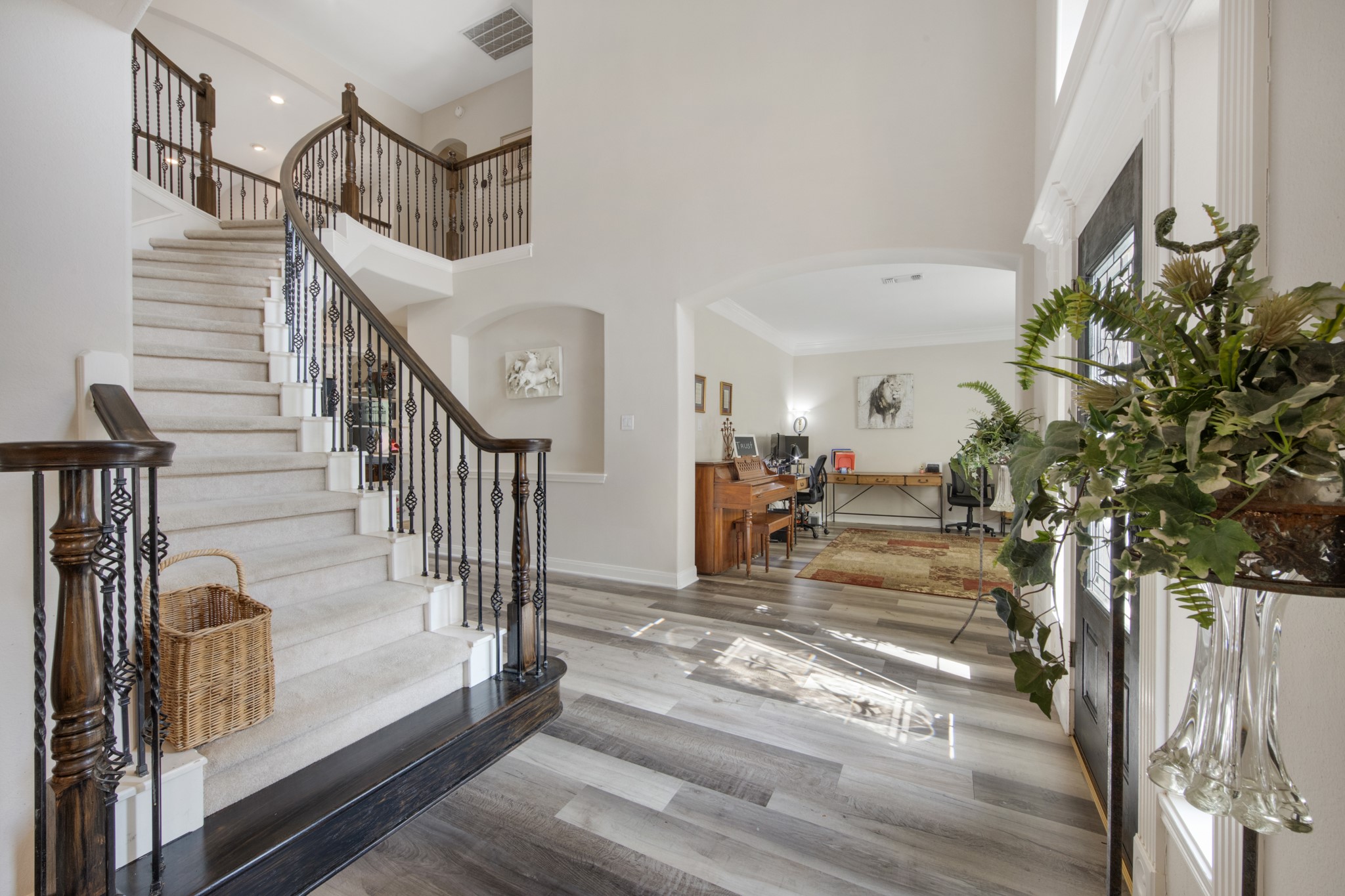 9510 Ashdown Forest Drive Spring, TX 77379 - Photo 6 of 50 Step inside to a breathtaking two-story foyer featuring soaring ceilings and a sweeping staircase. Natural light pours through the large front windows creating a bright and open entrance.
