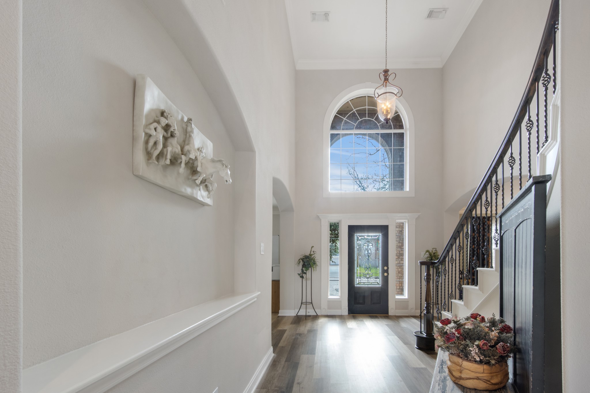 9510 Ashdown Forest Drive Spring, TX 77379 - Photo 8 of 50 Spacious entry hall with beautiful flooring and high ceilings creates a welcoming flow into the main living areas of the home.