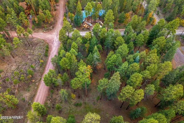 a backyard of a house with a yard with outdoor seating