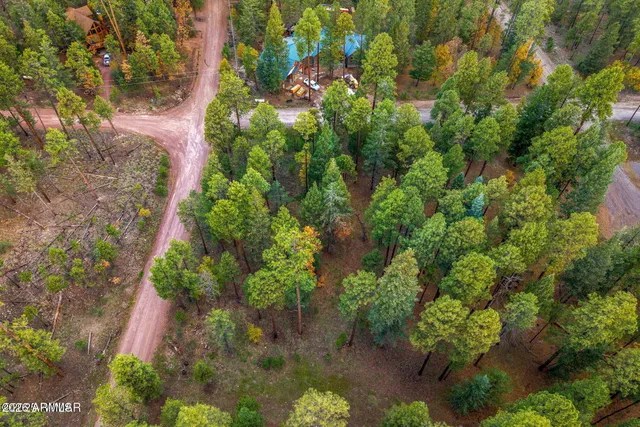 a backyard of a house with a yard with outdoor seating